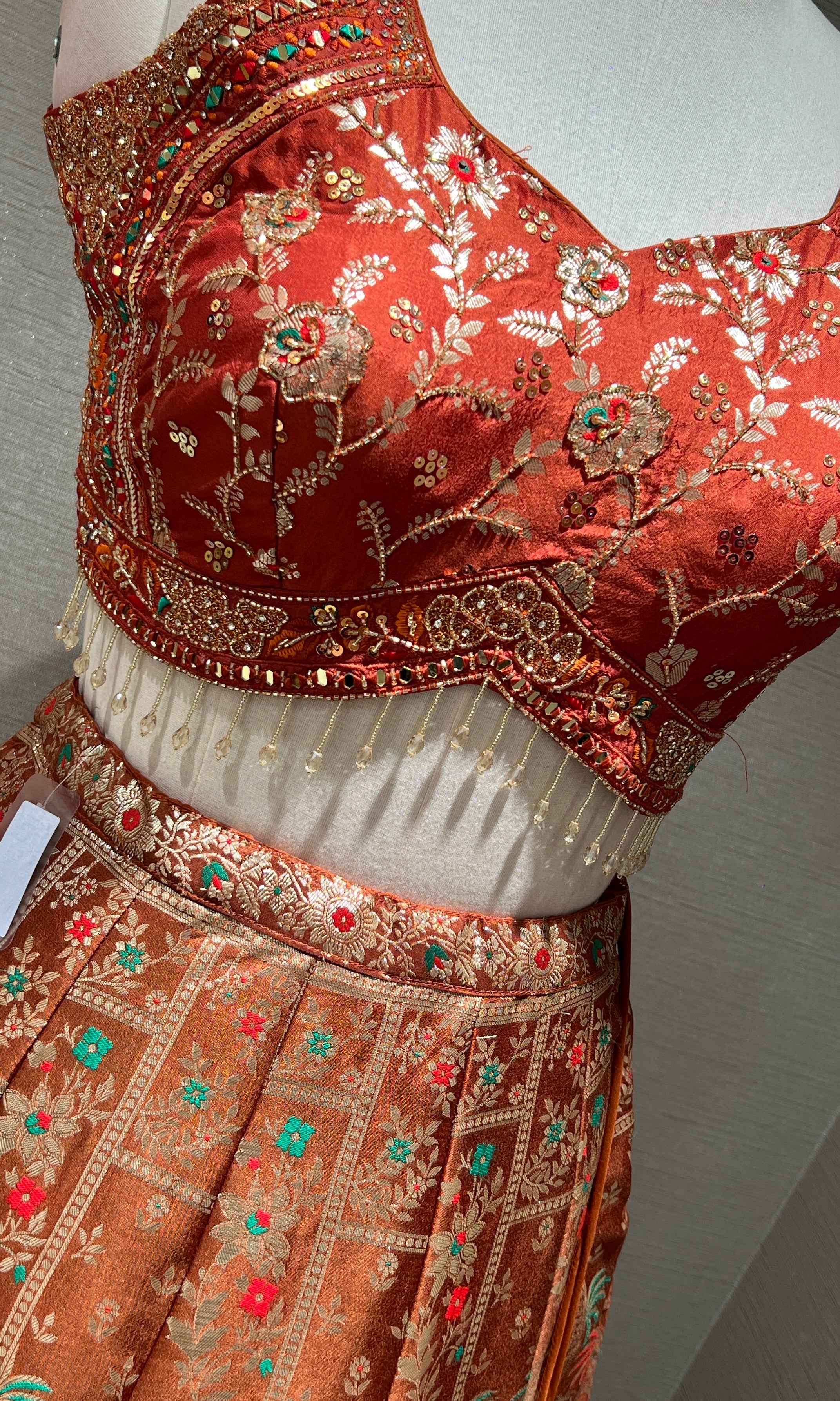 Rust orange Lehenga with Floral and Peacock embroidery