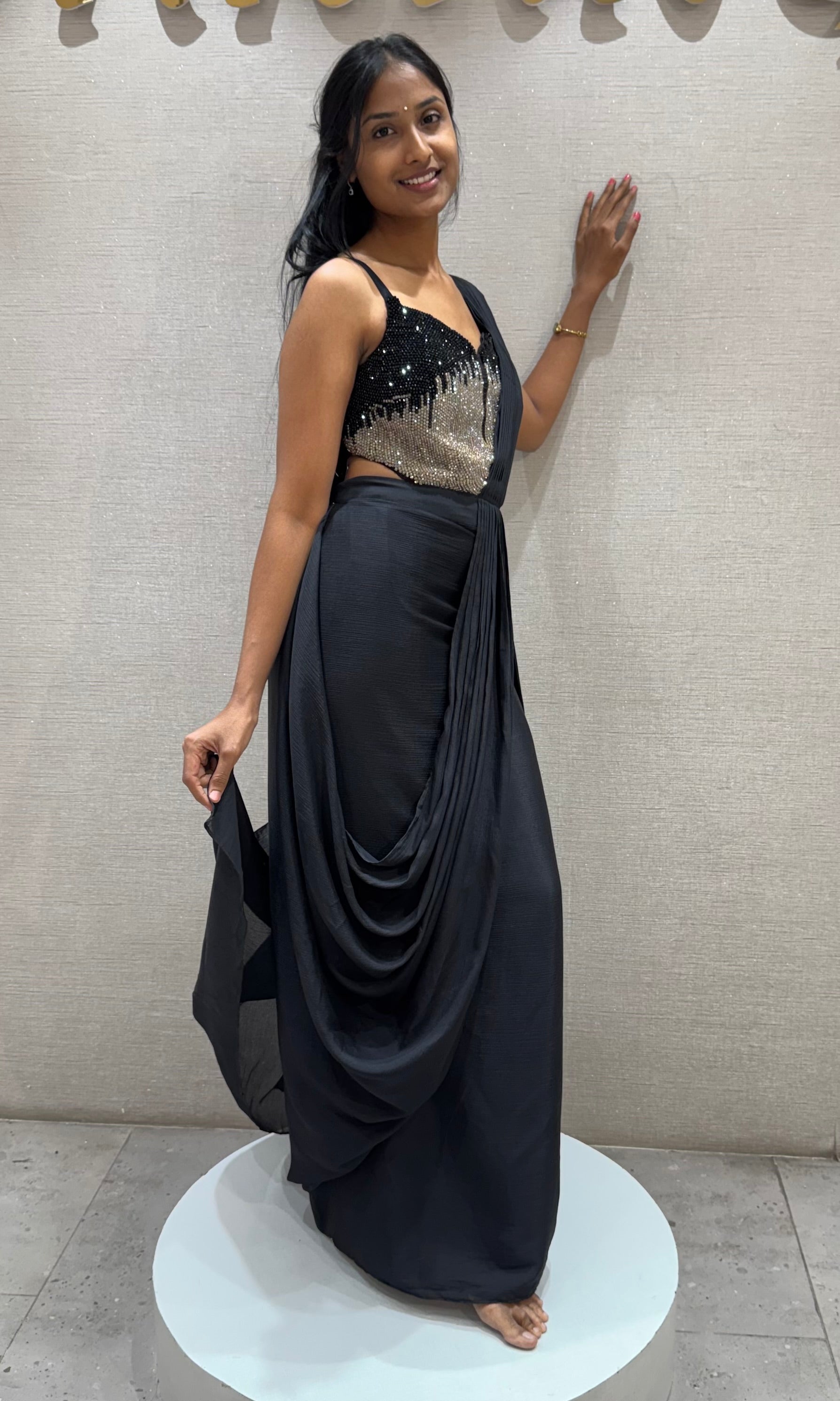 black draped saree with sequined corset blouse