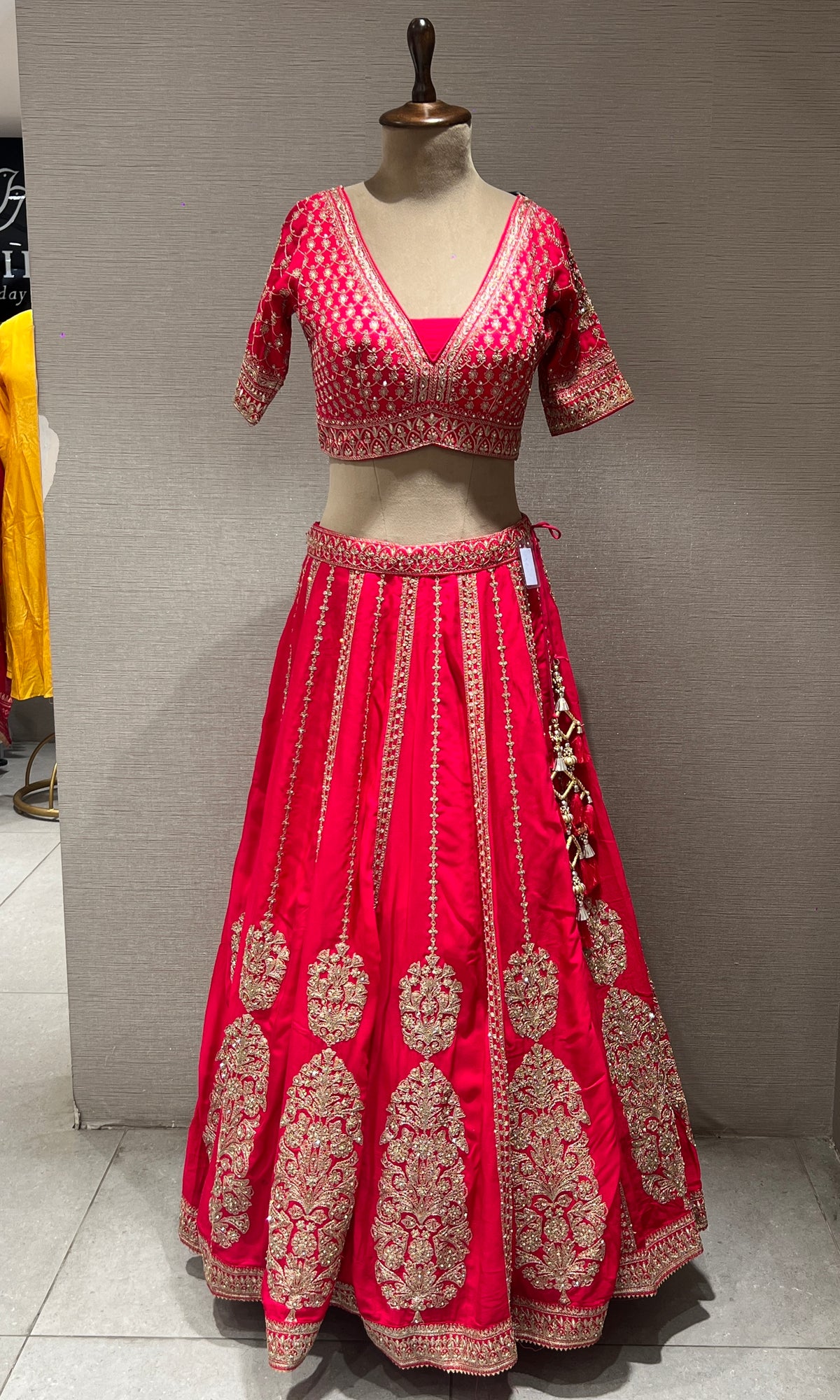 rani pink lehenga with intricate embroidery