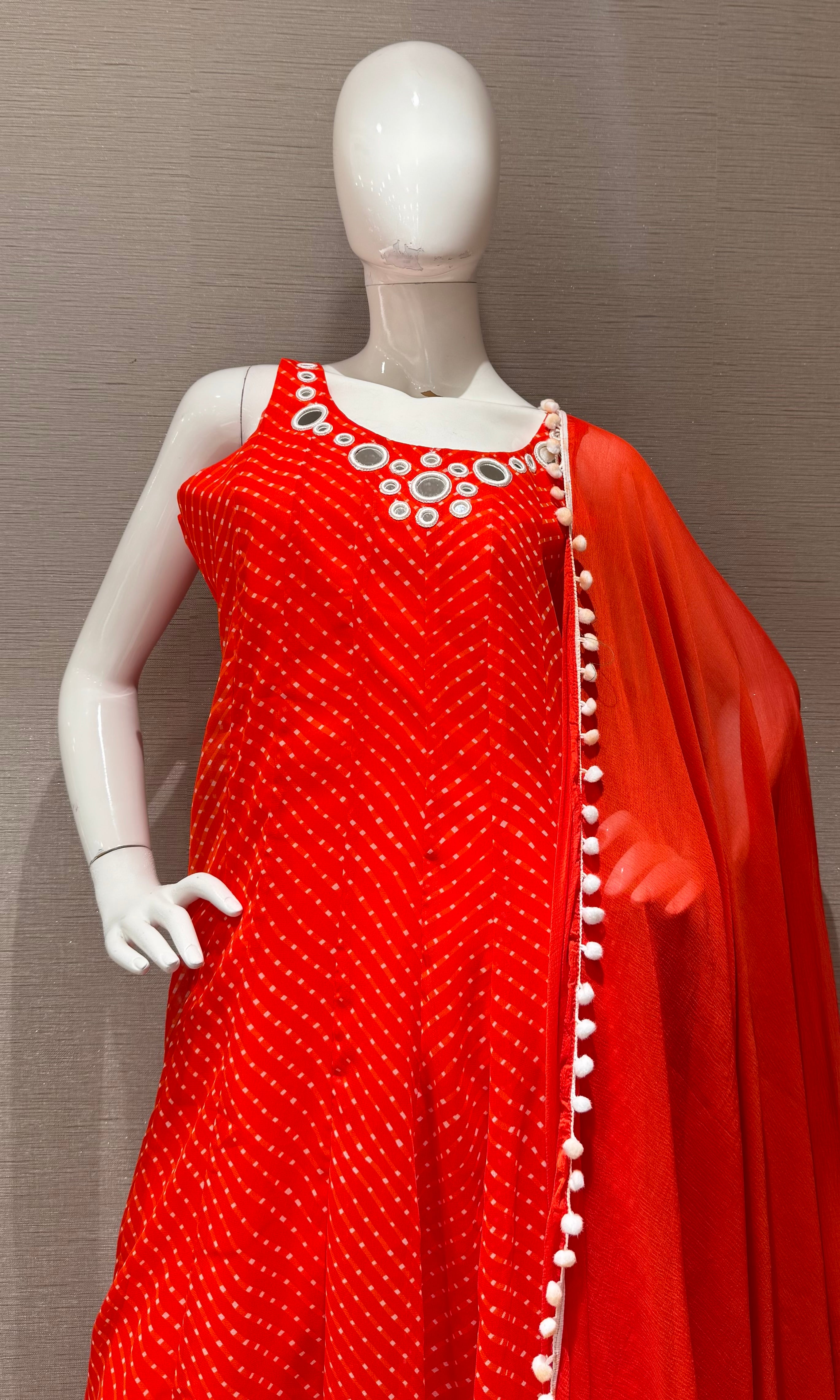 Orange bandhani print and intricate mirror anarkali set