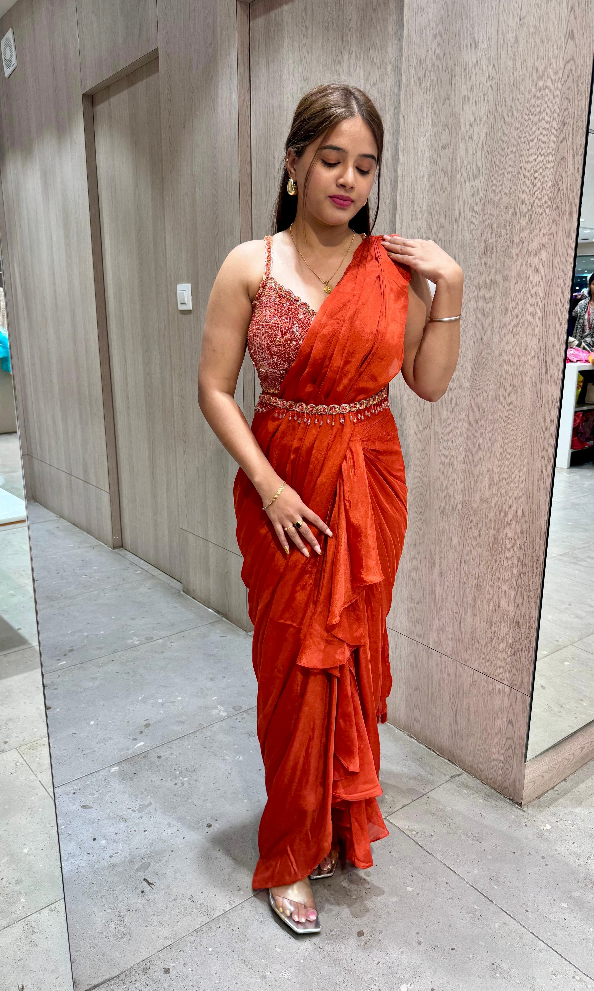 rust orange drape ruffled saree with blouse and belt