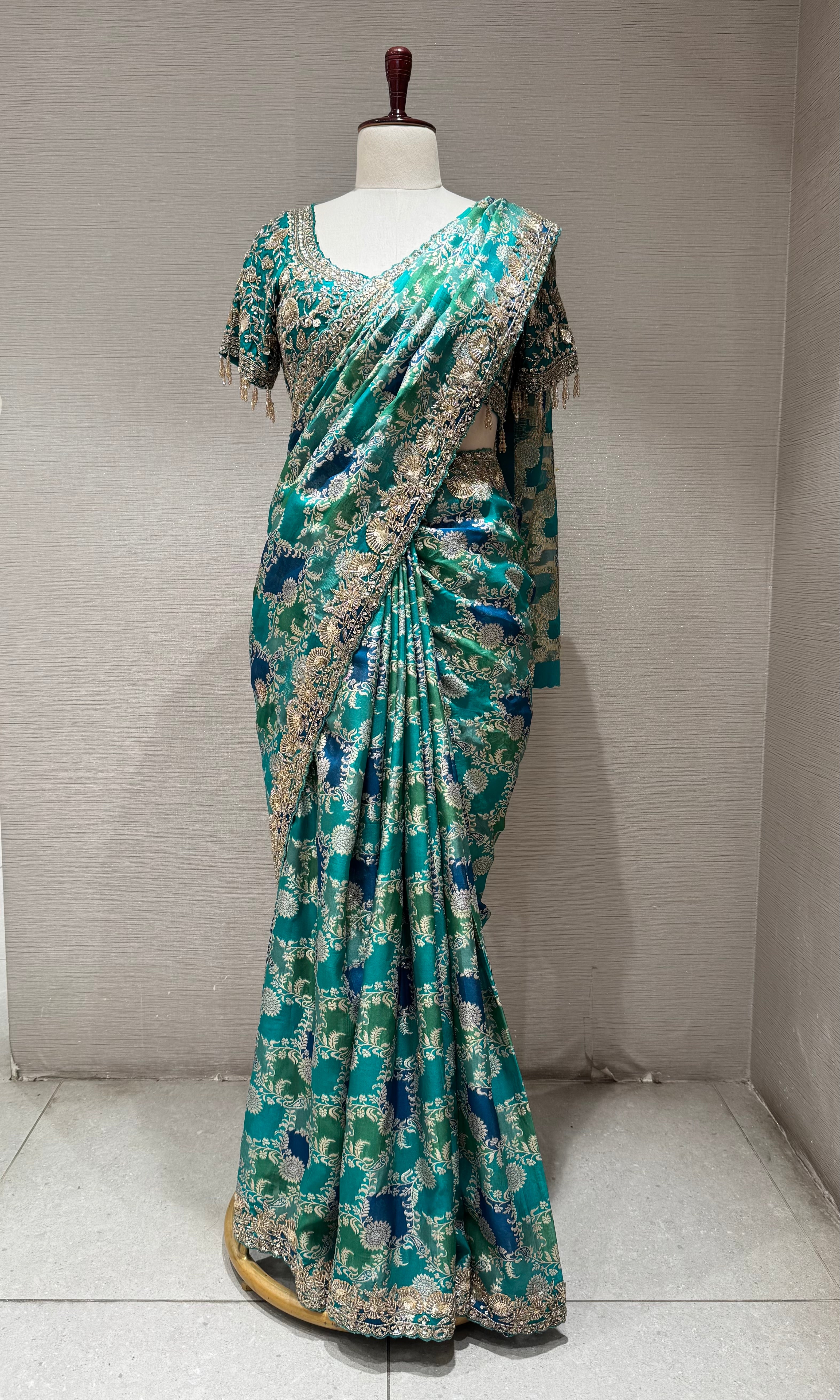 Green printed saree with an embellished Blouse