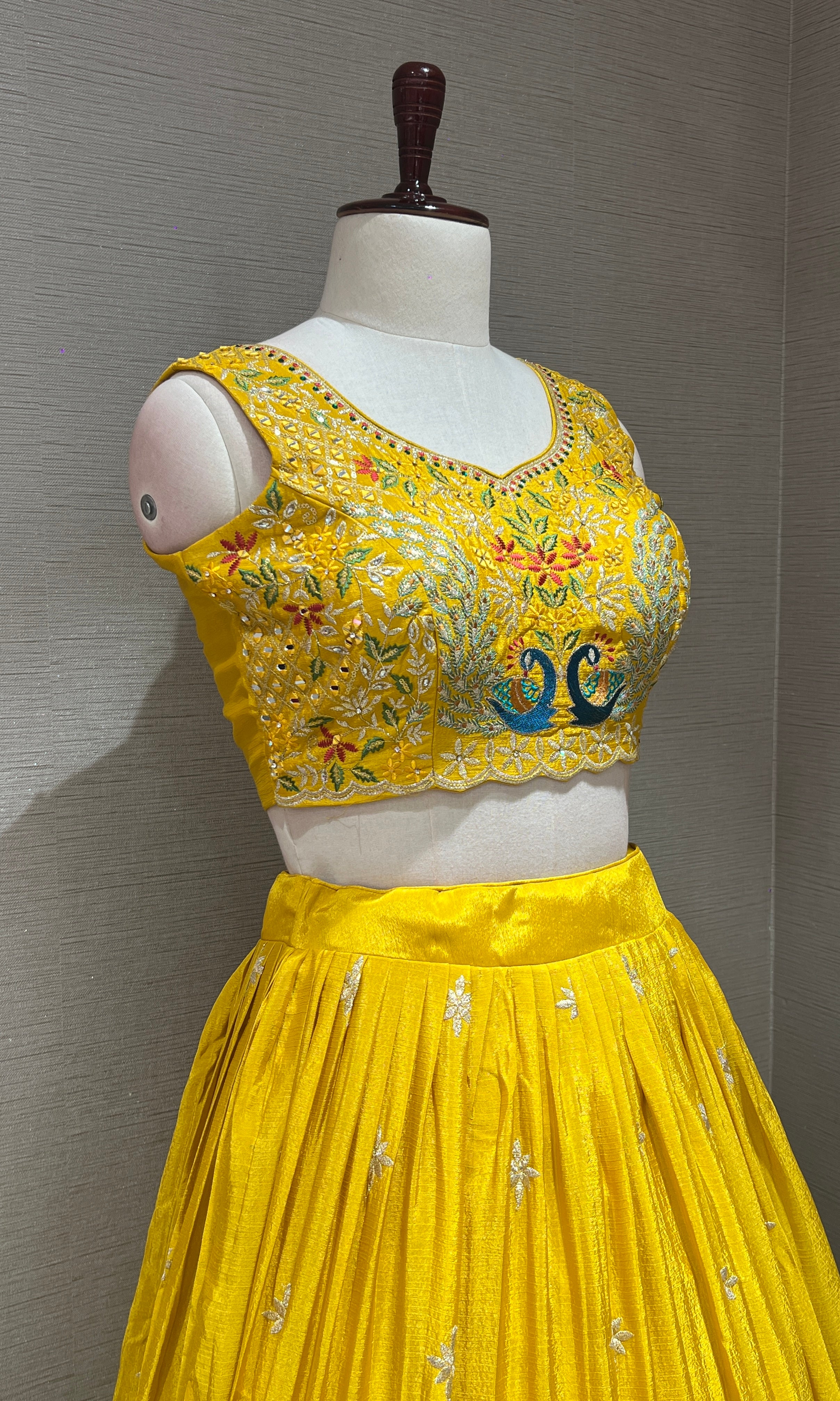yellow lehenga with peacock design