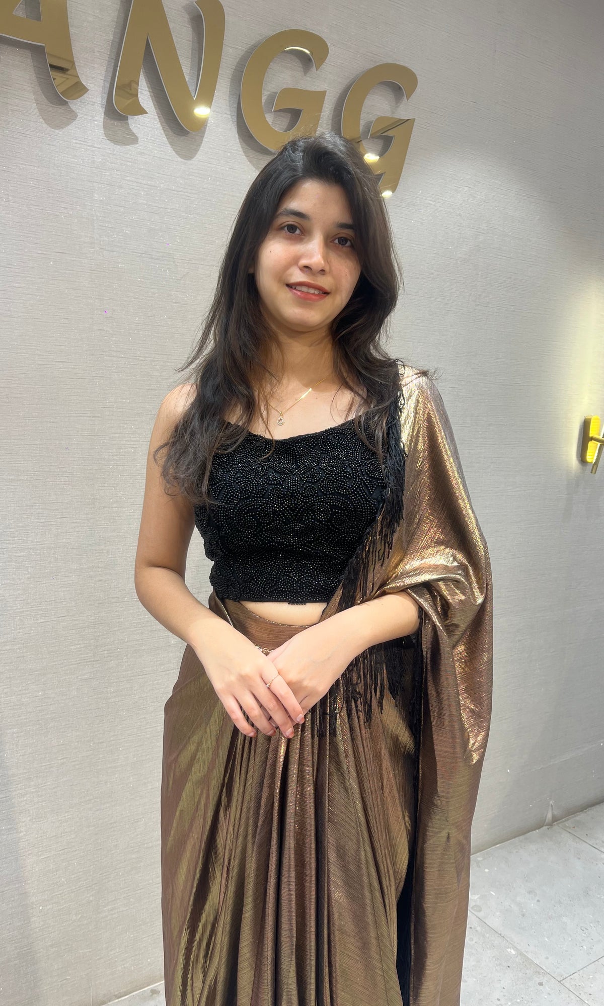 Metallic Brown Pleated Saree with Embroidered Black Blouse