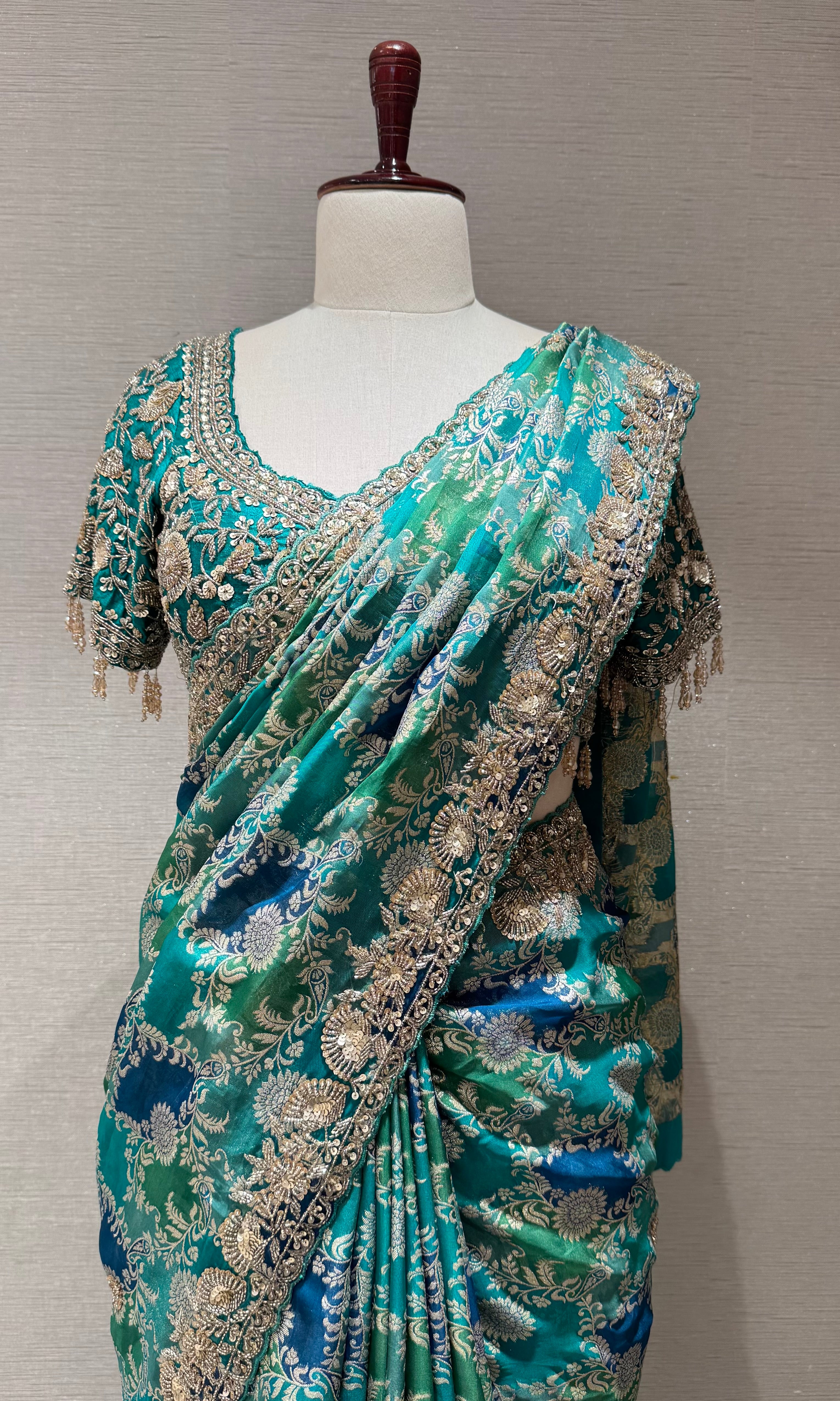 Green printed saree with an embellished Blouse