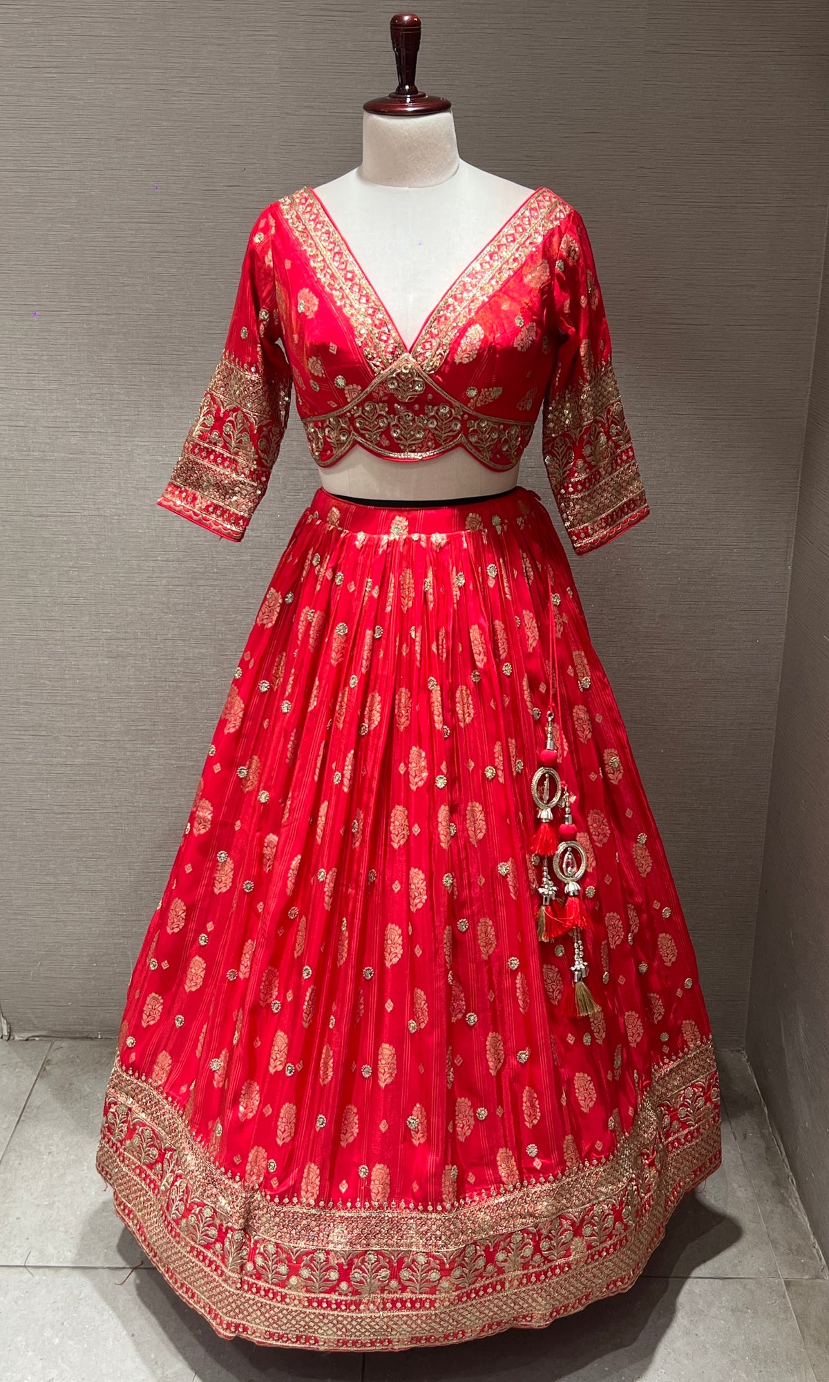 pink lehenga with intricate gold detailing