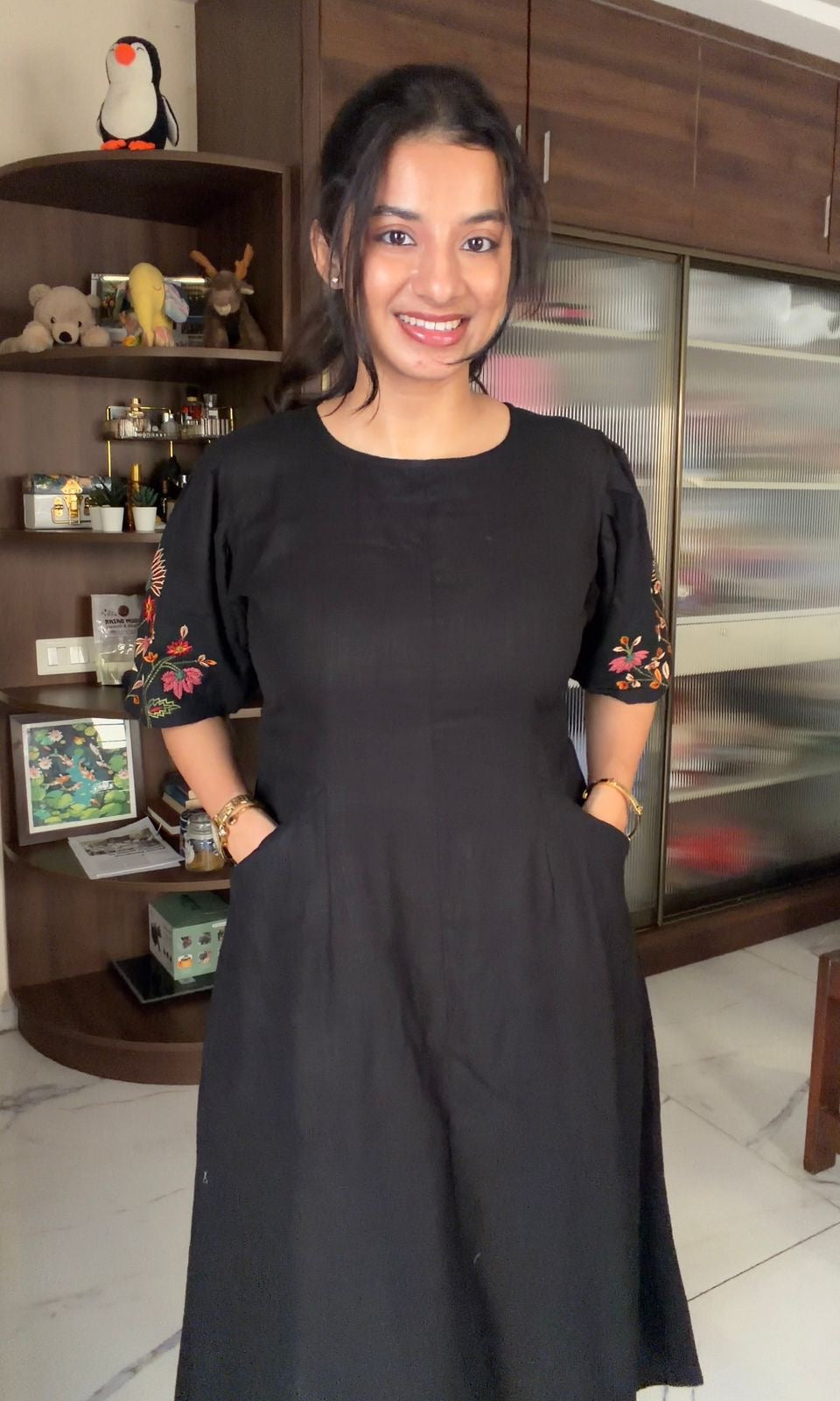 Black dress with embroidered puff sleeves