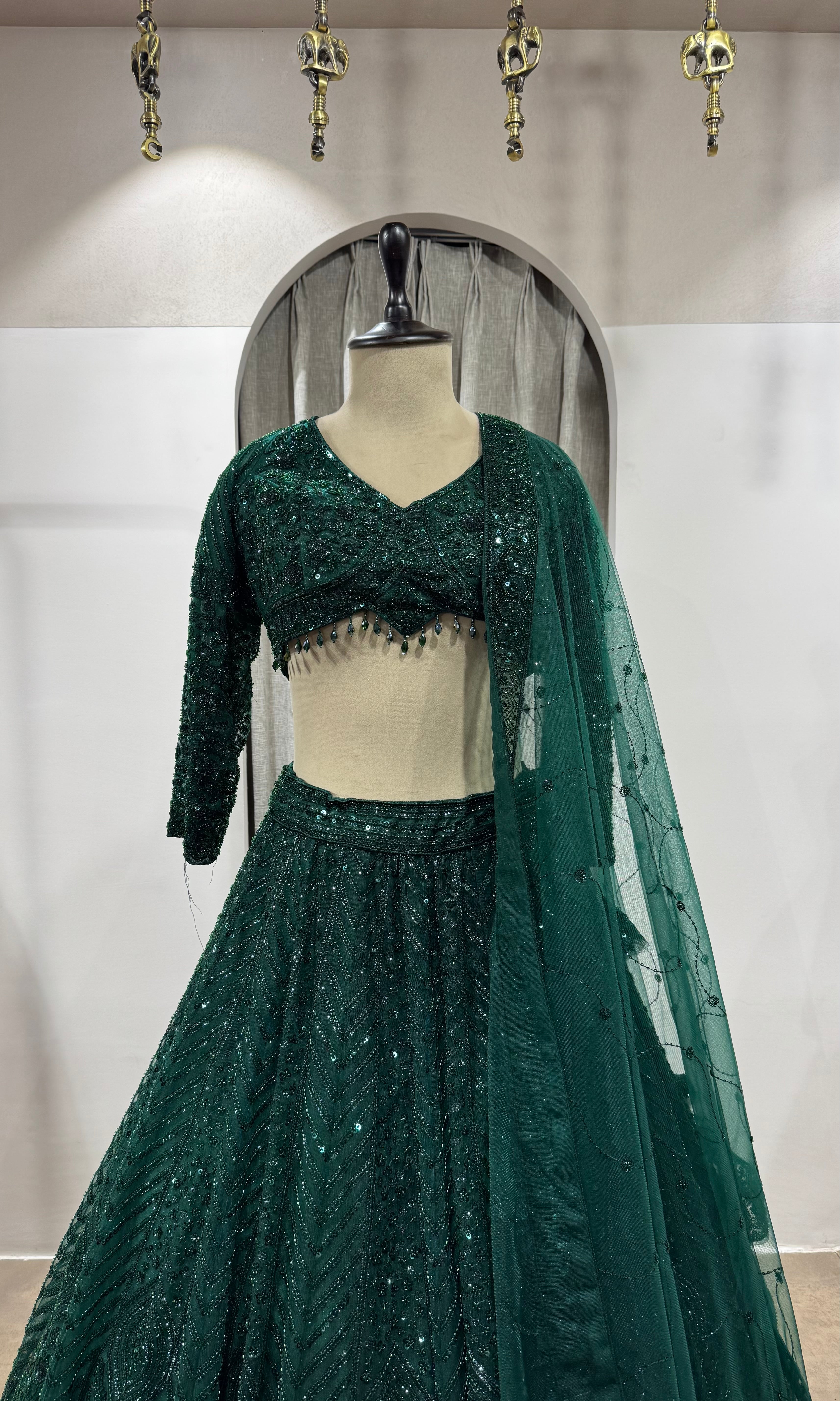 emerald green net lehenga choli