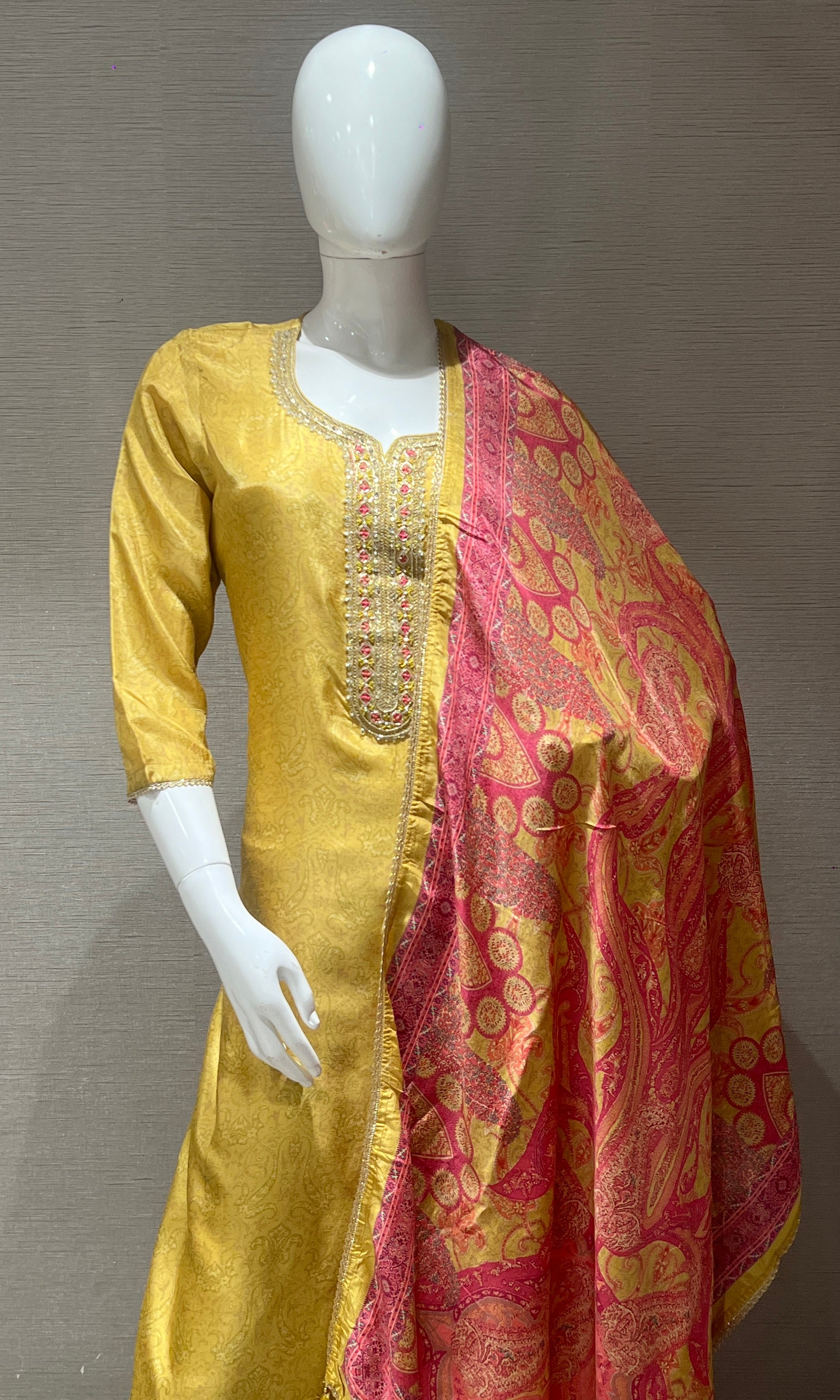 golden yellow kurta set with pink duppata