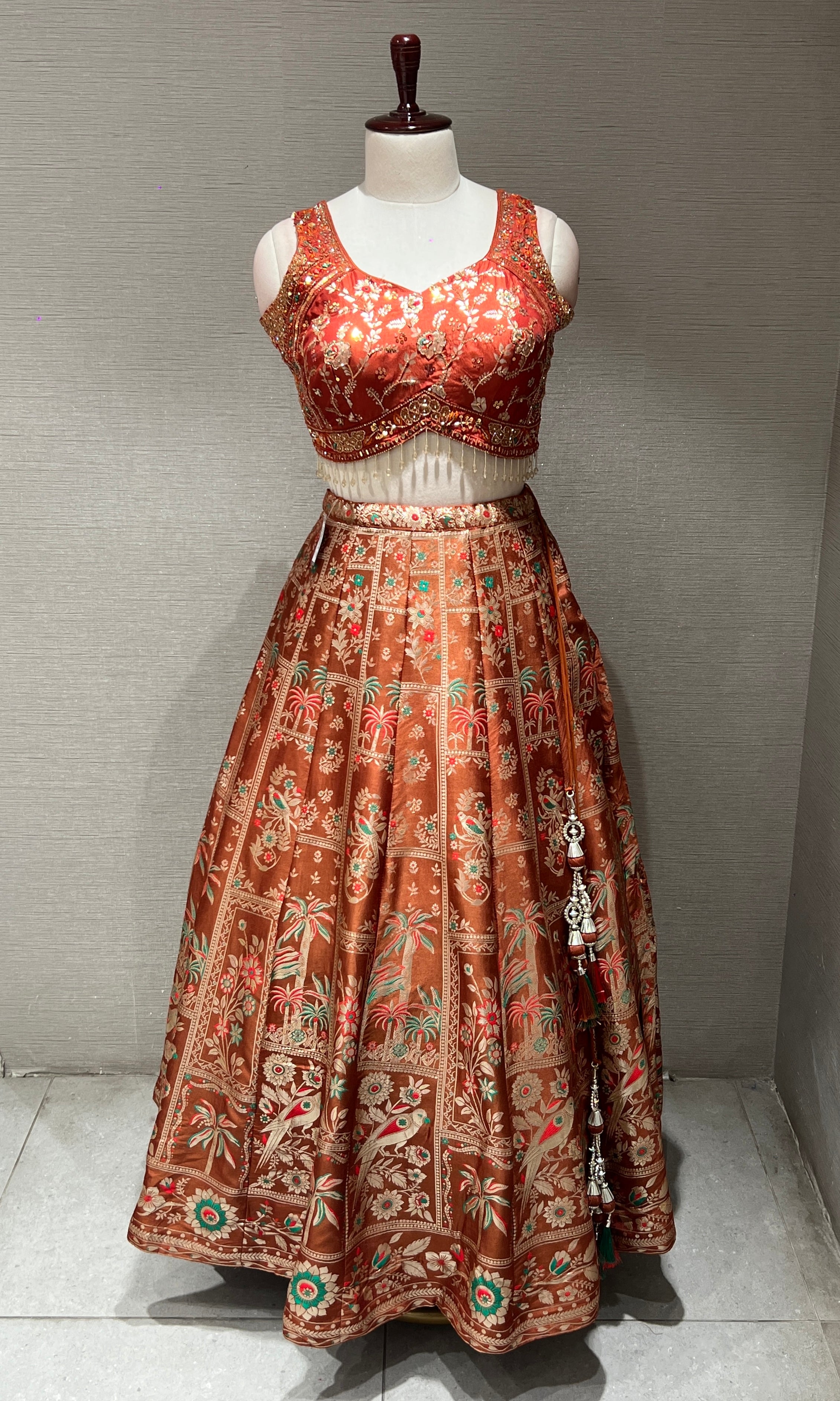 Rust orange Lehenga with Floral and Peacock embroidery