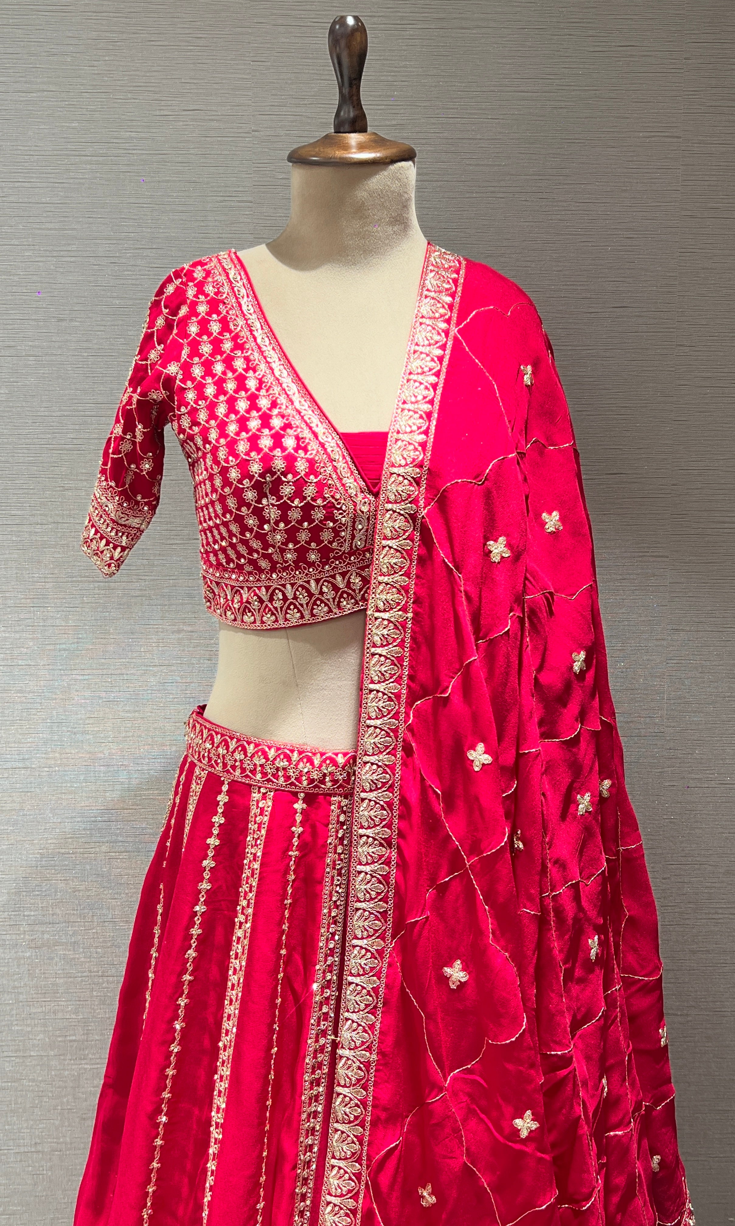 rani pink lehenga with intricate embroidery