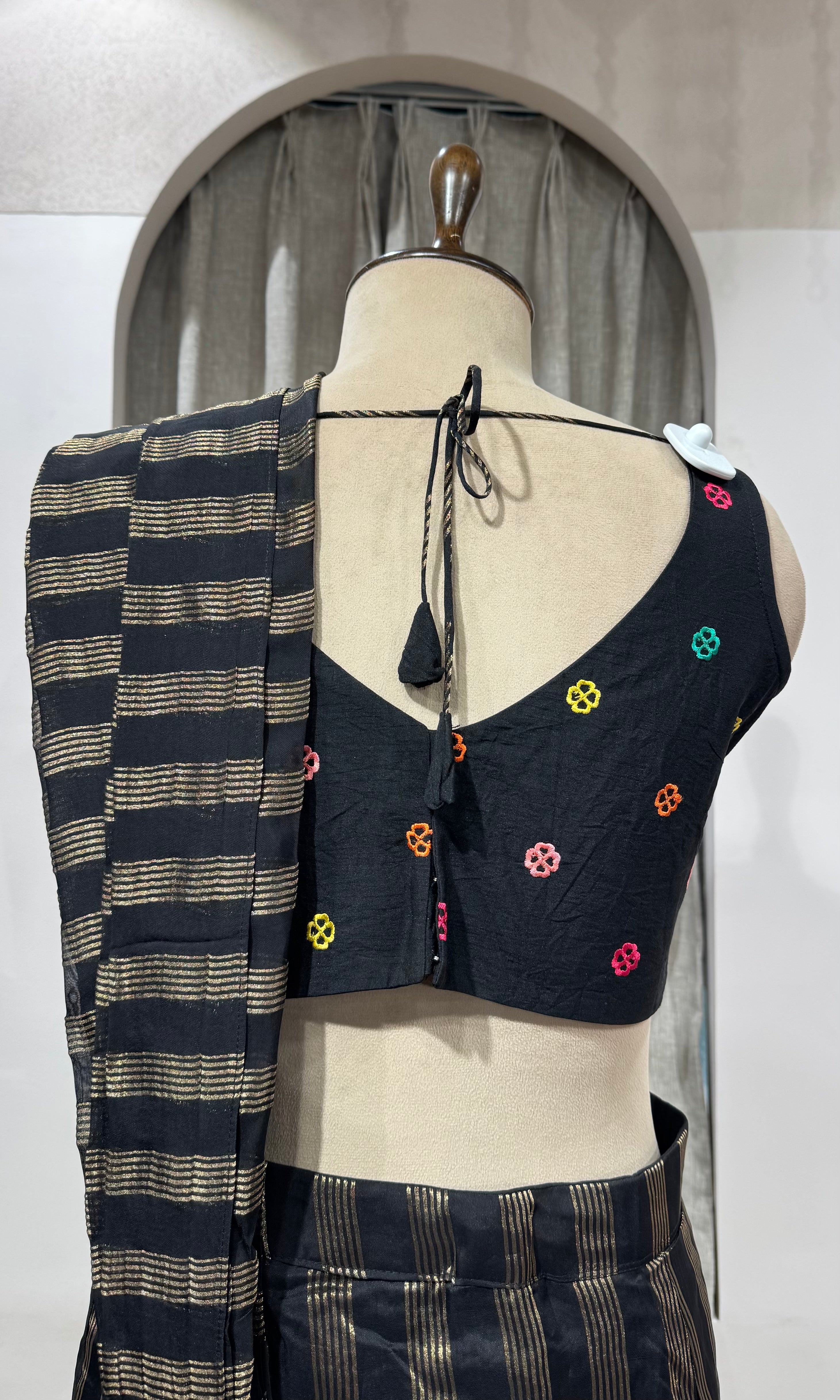 Black and silver striped drape saree with intricate blouse