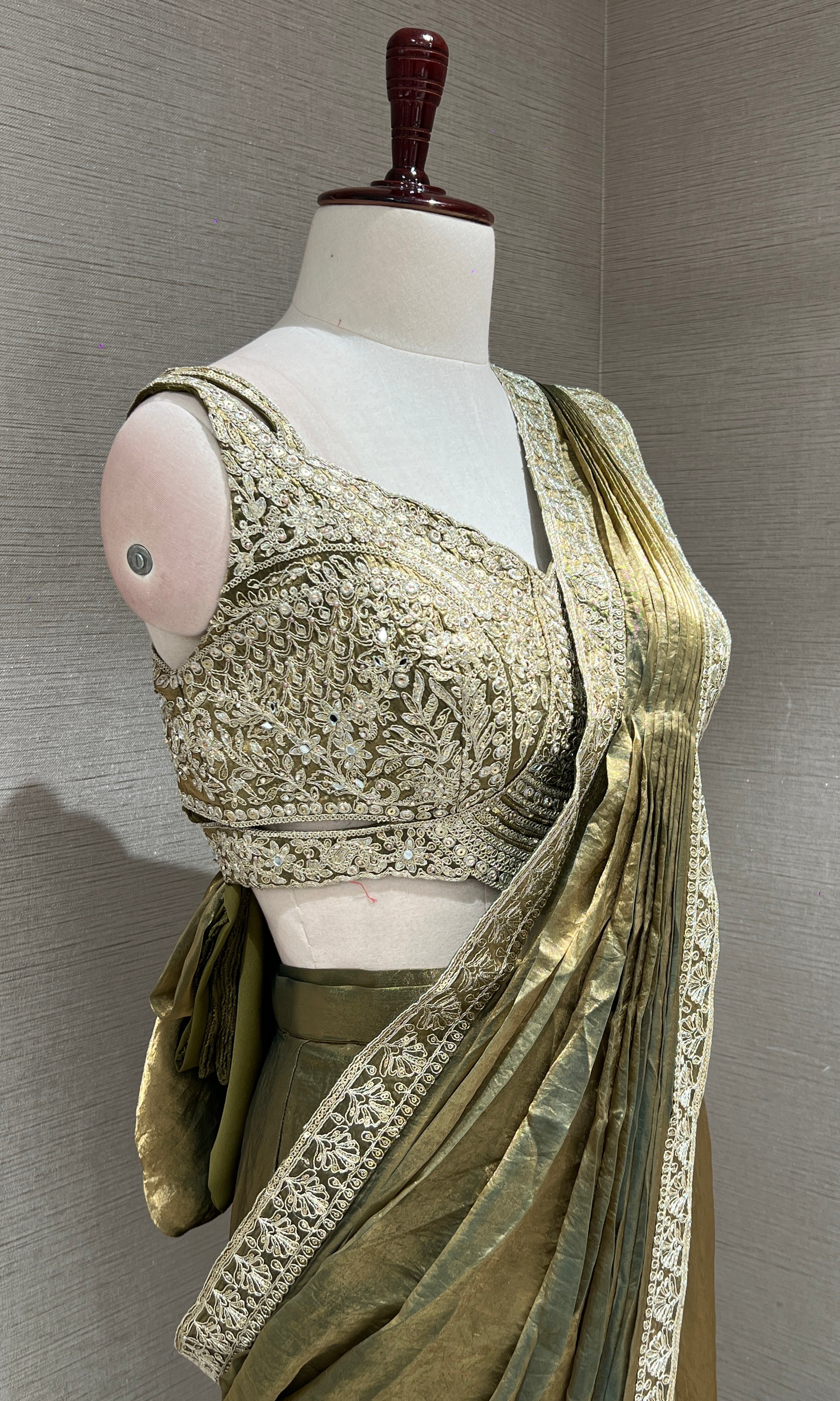 metallic green drape saree with gold border
