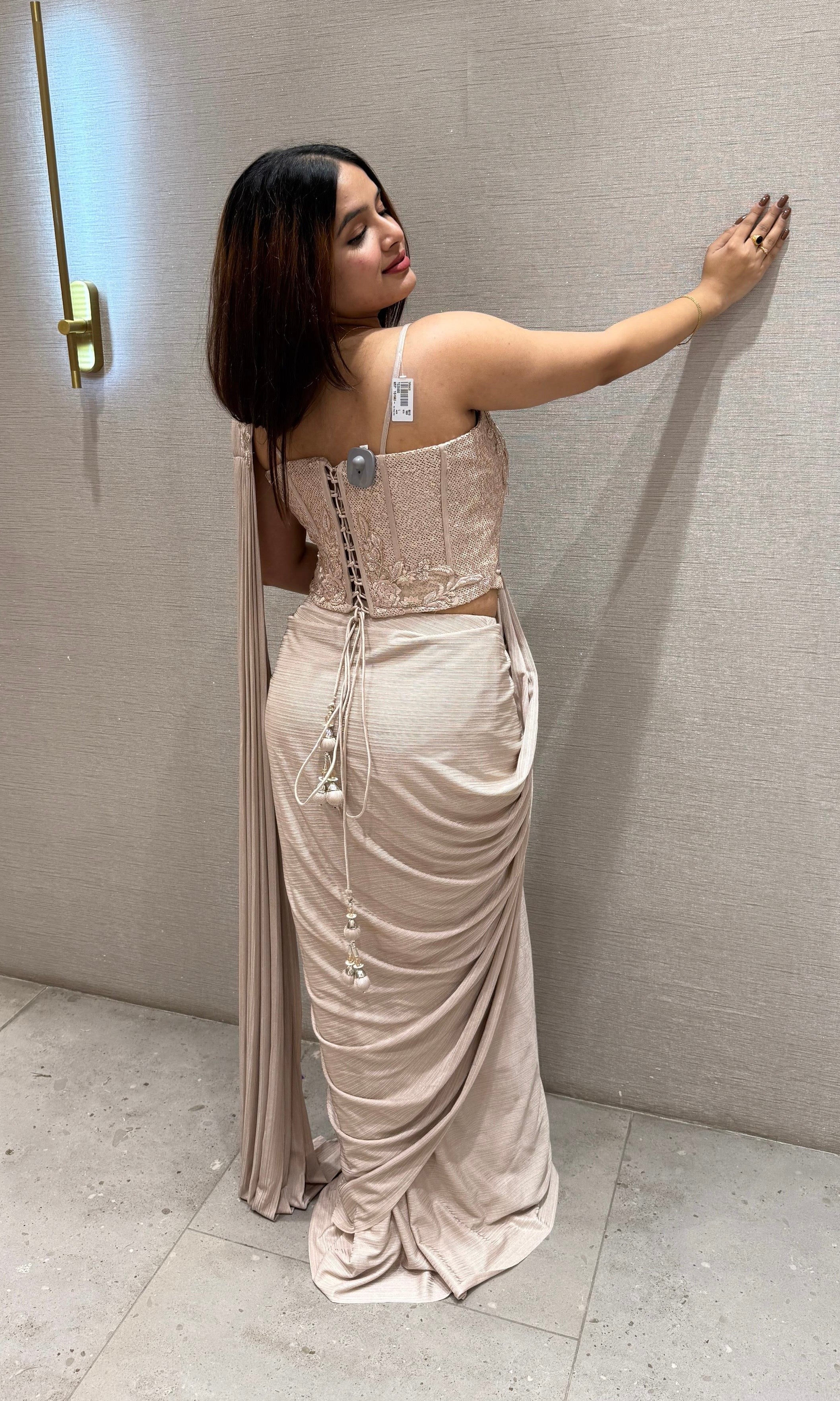 Beige drape saree with corset blouse