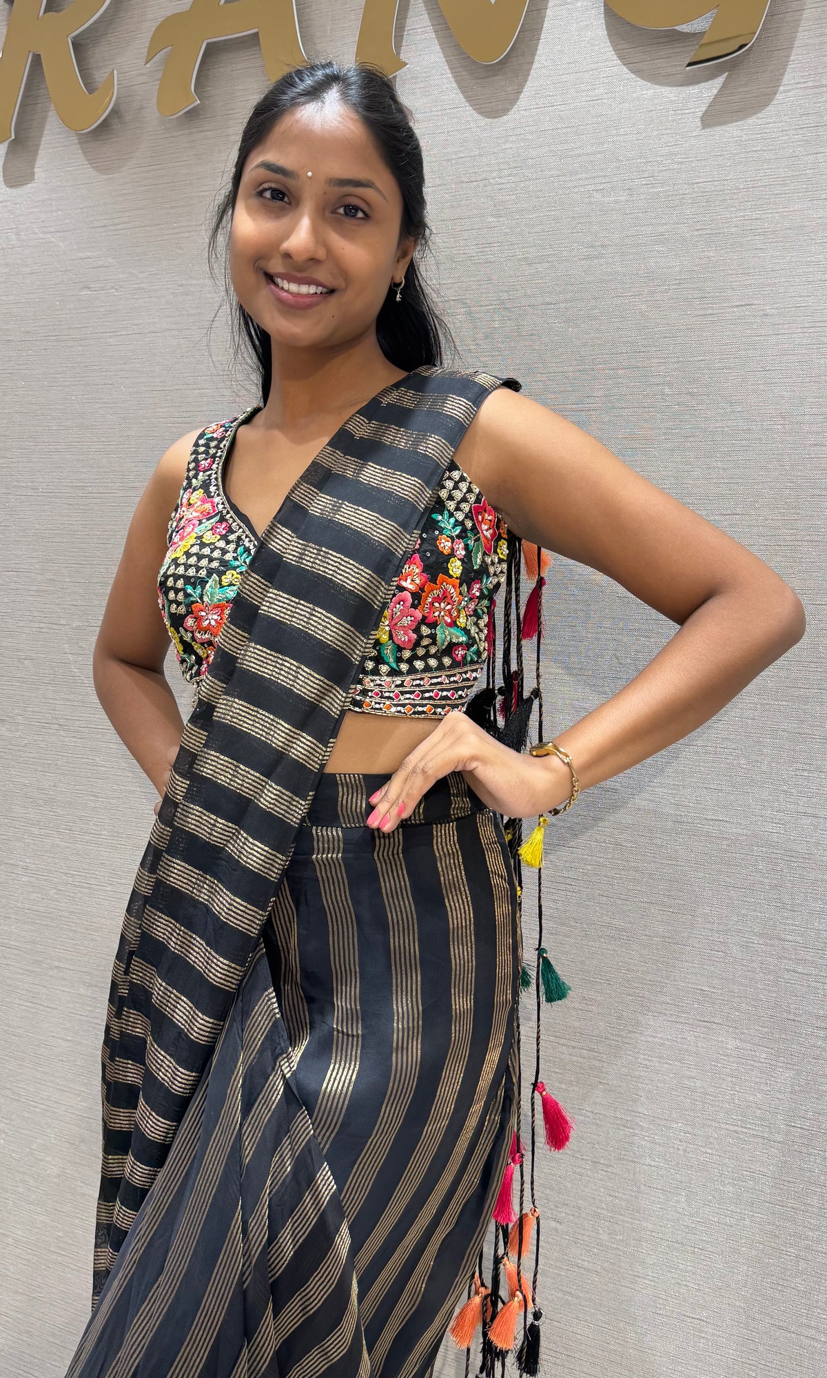Black and silver striped drape saree with intricate blouse