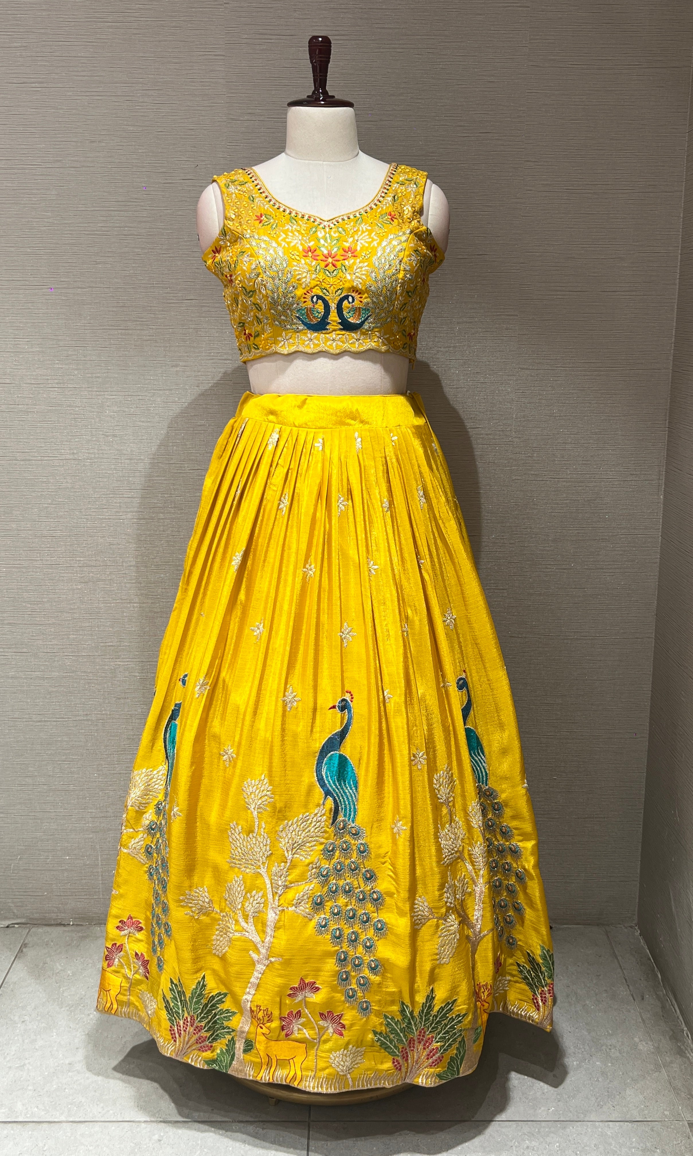 yellow lehenga with peacock design