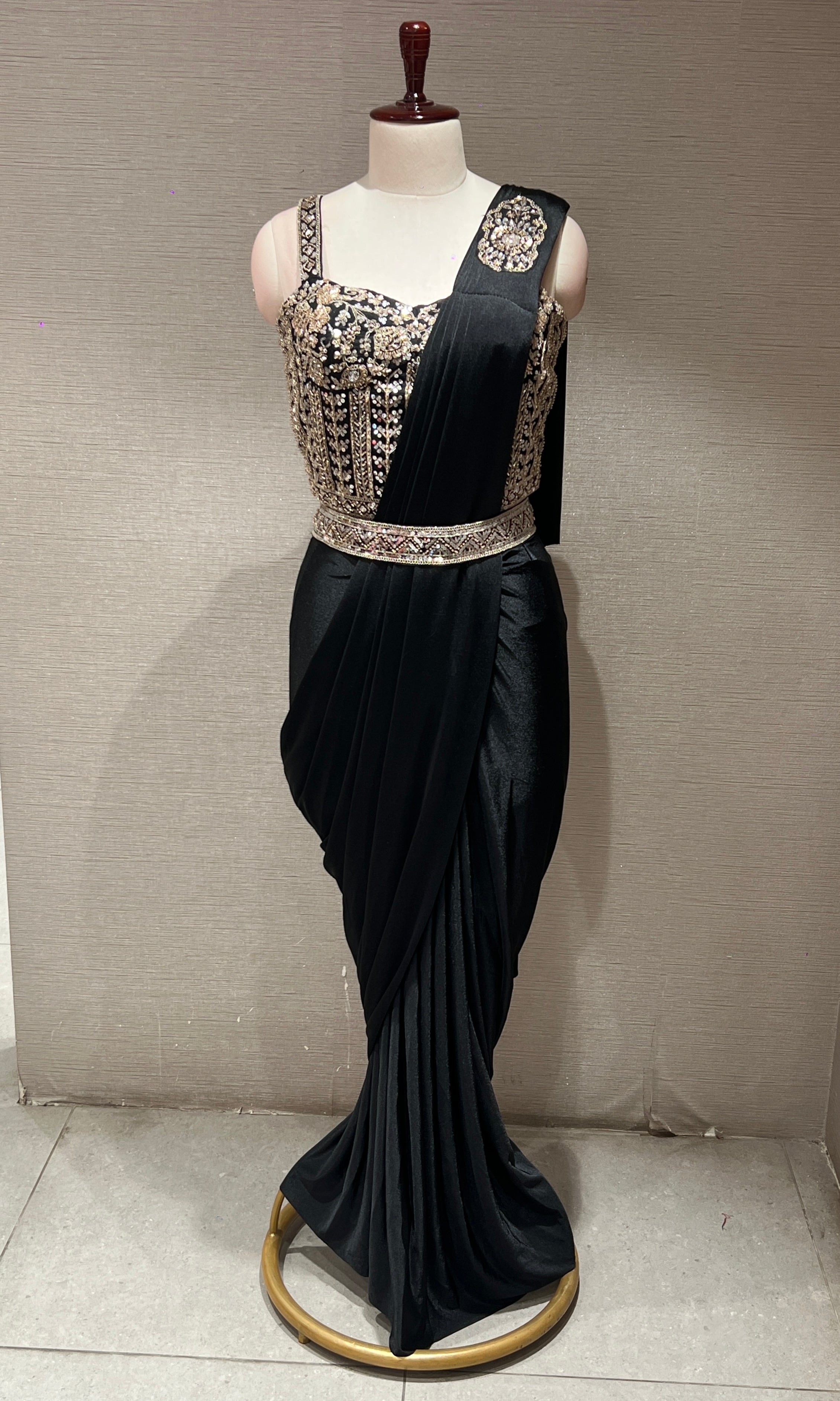 black drape saree with corset blouse and belt
