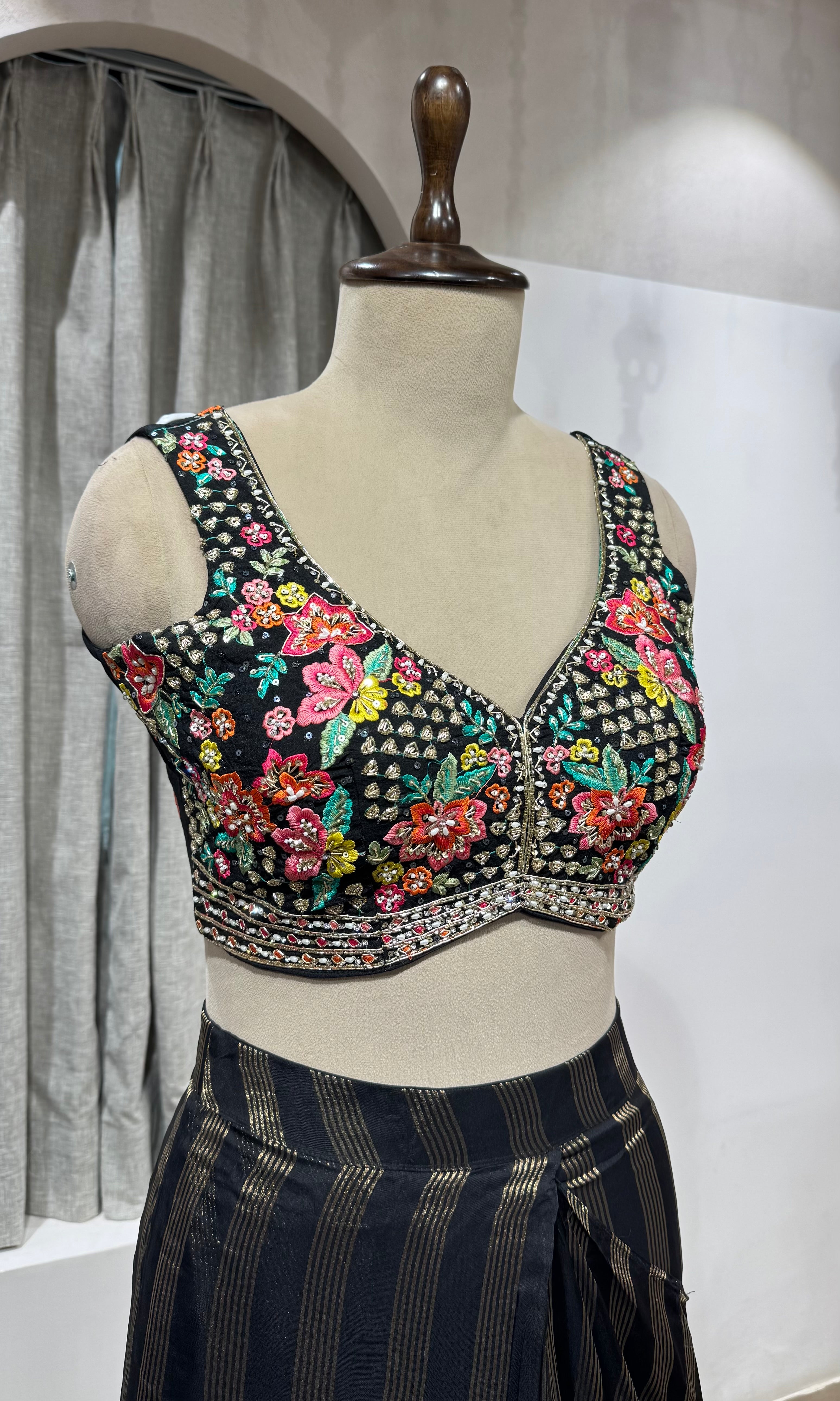Black and silver striped drape saree with intricate blouse