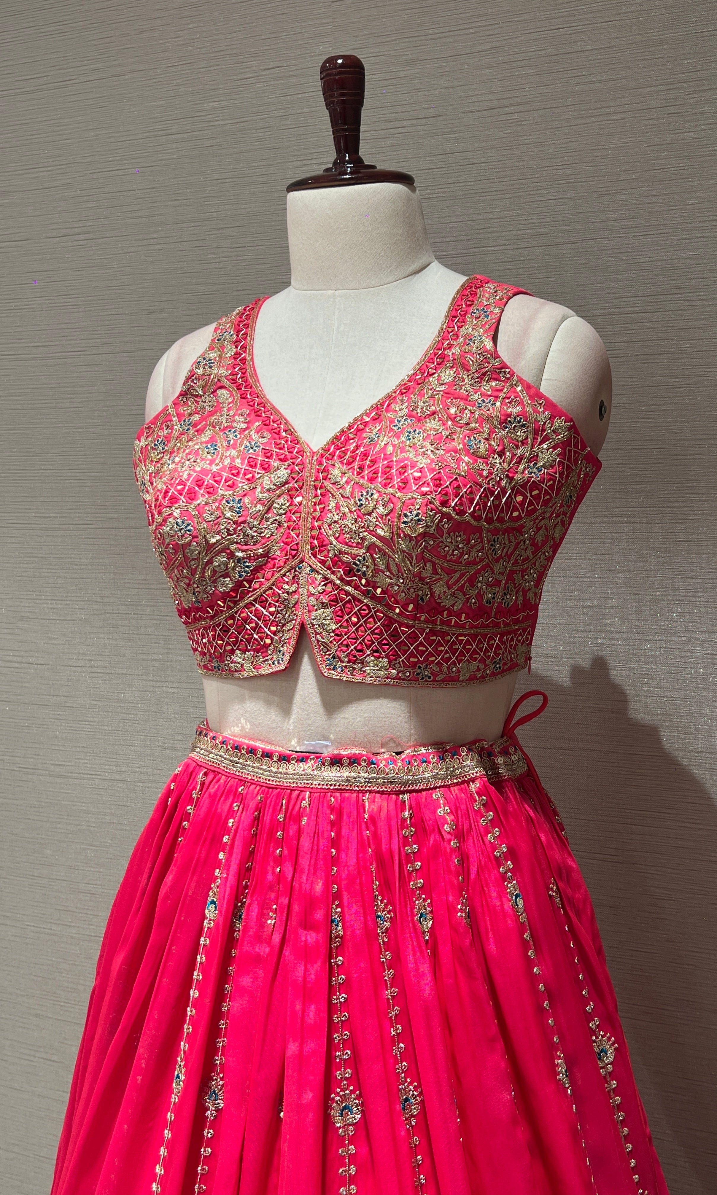 rani pink lehenga with intricate embroidery