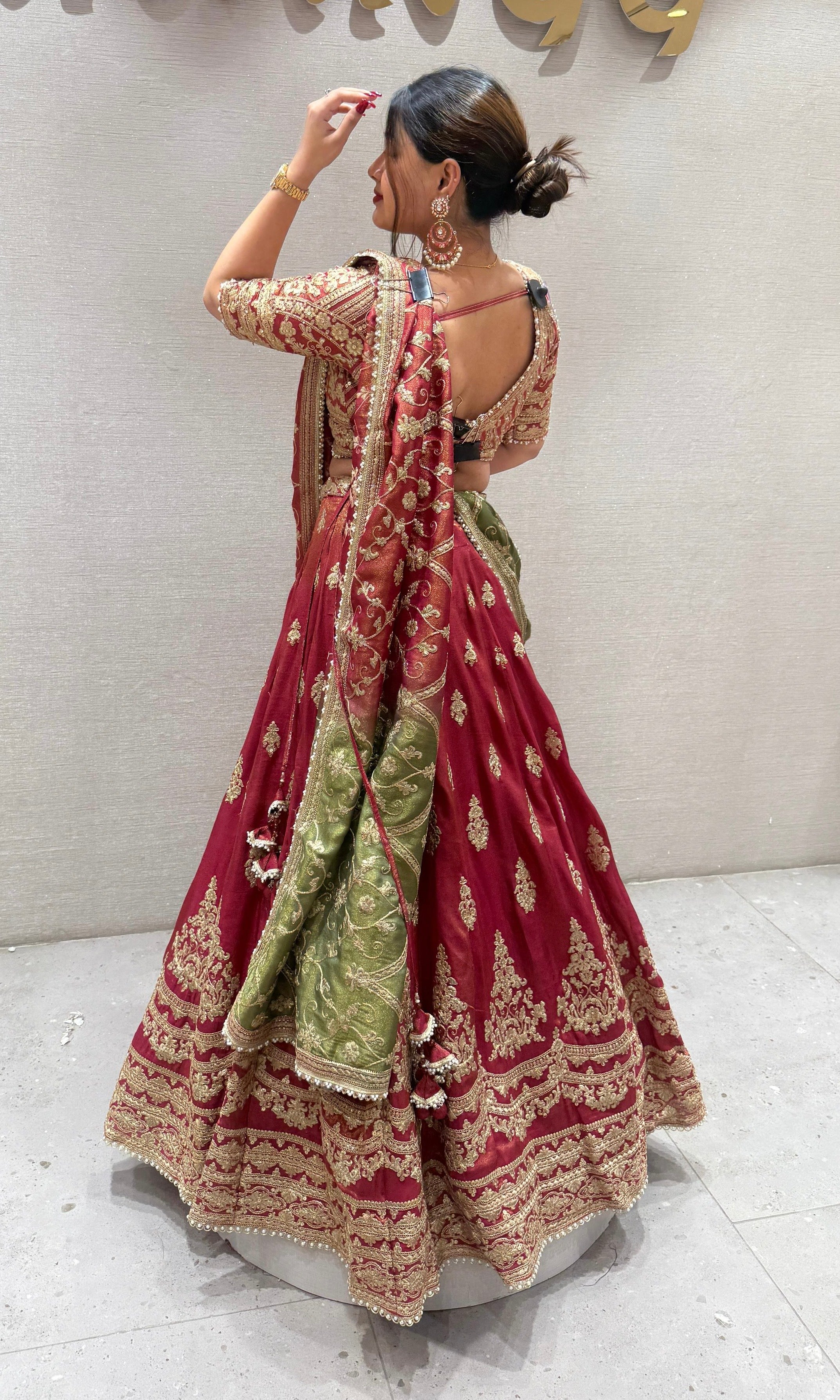Brick red and green Lehenga with potli