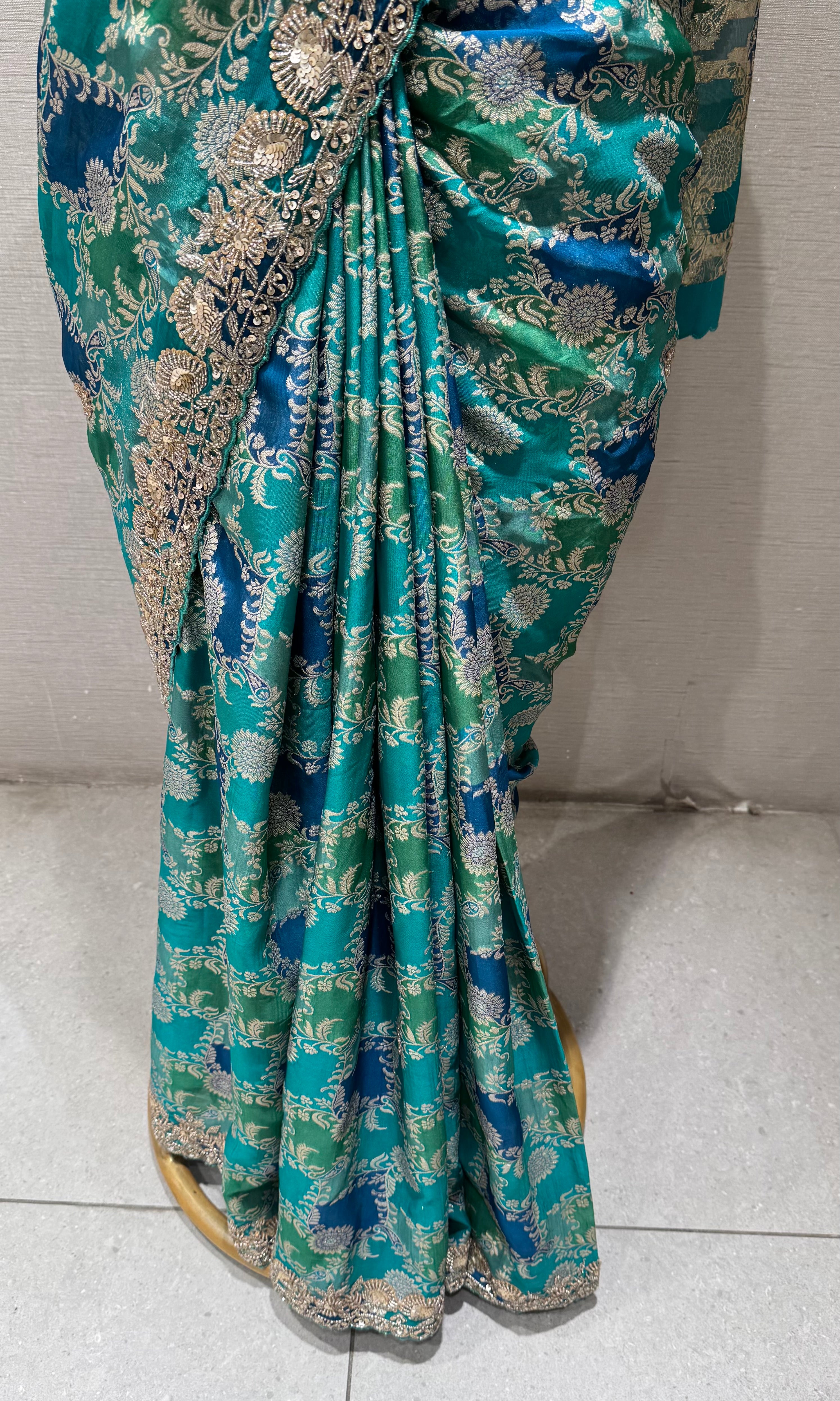 Green printed saree with an embellished Blouse