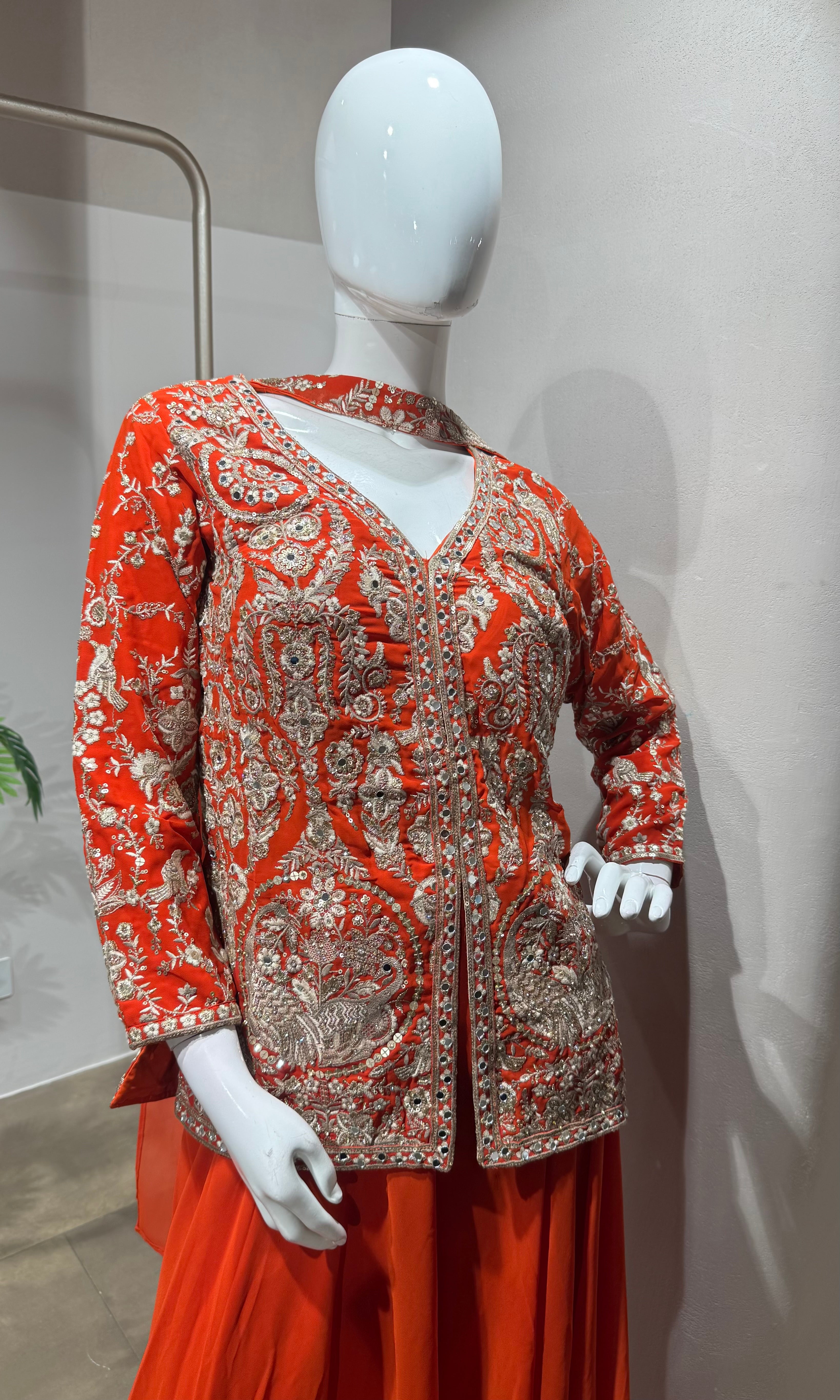 orange and gold embroidered sharara set