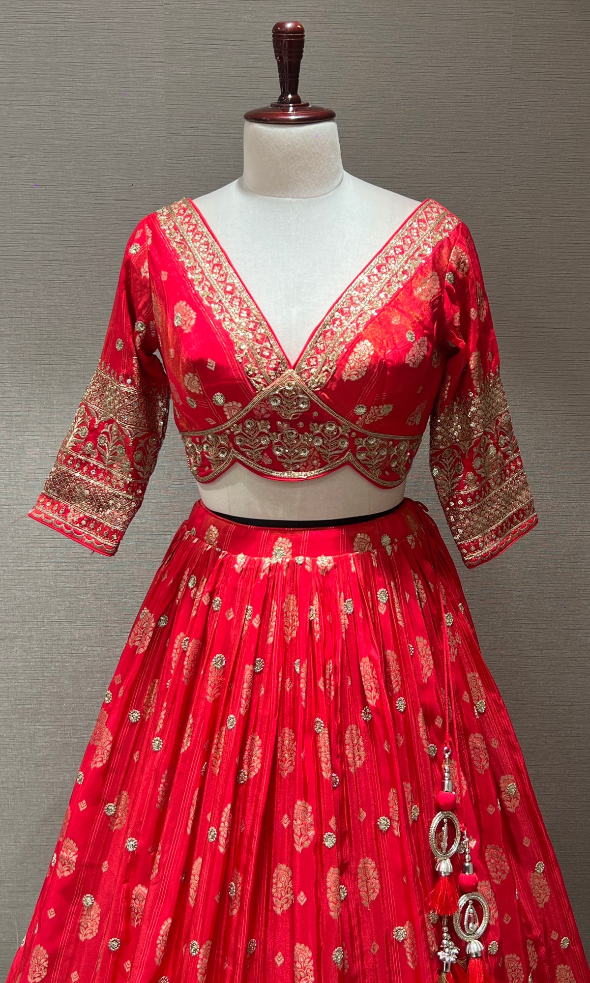 pink lehenga with intricate gold detailing