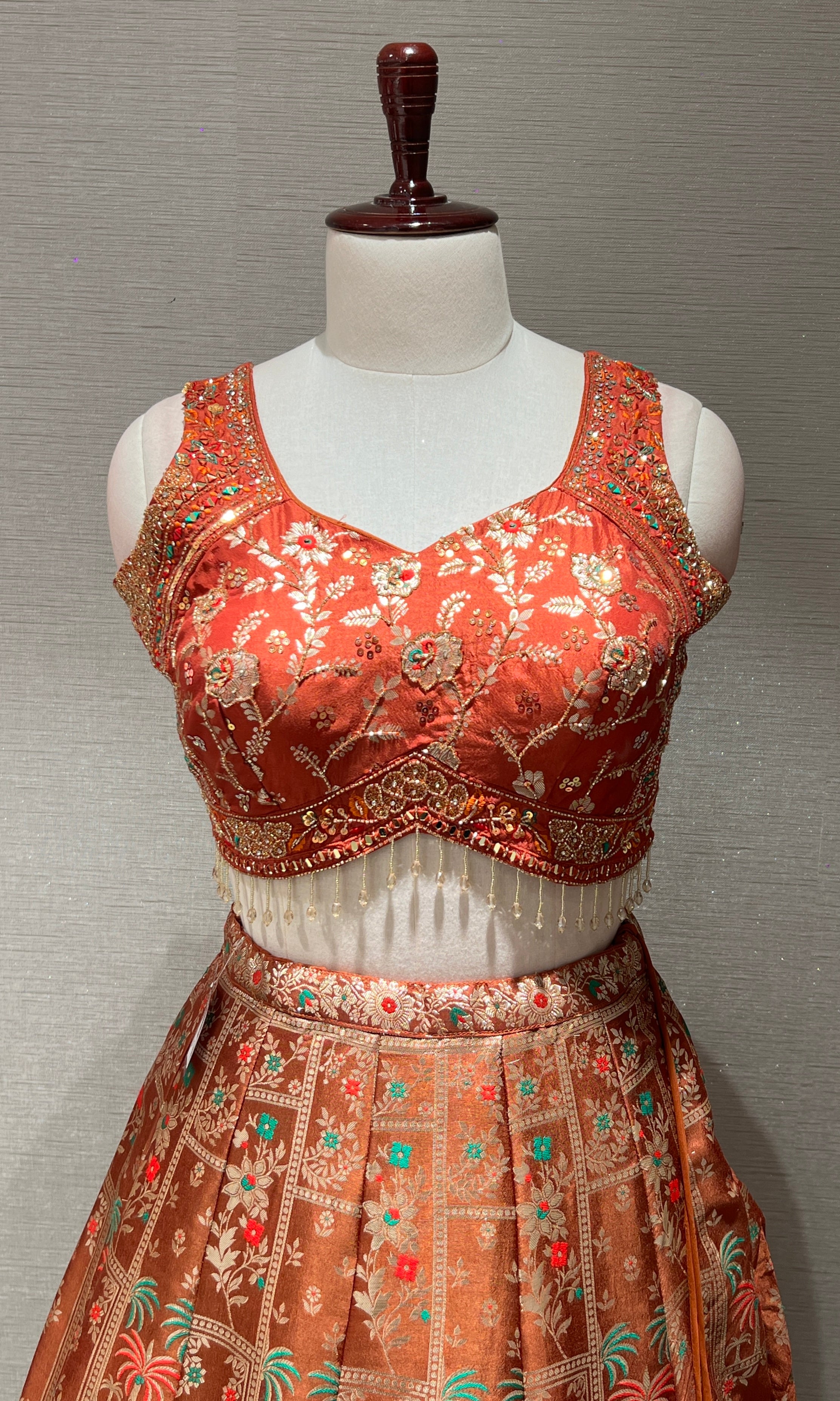 Rust orange Lehenga with Floral and Peacock embroidery