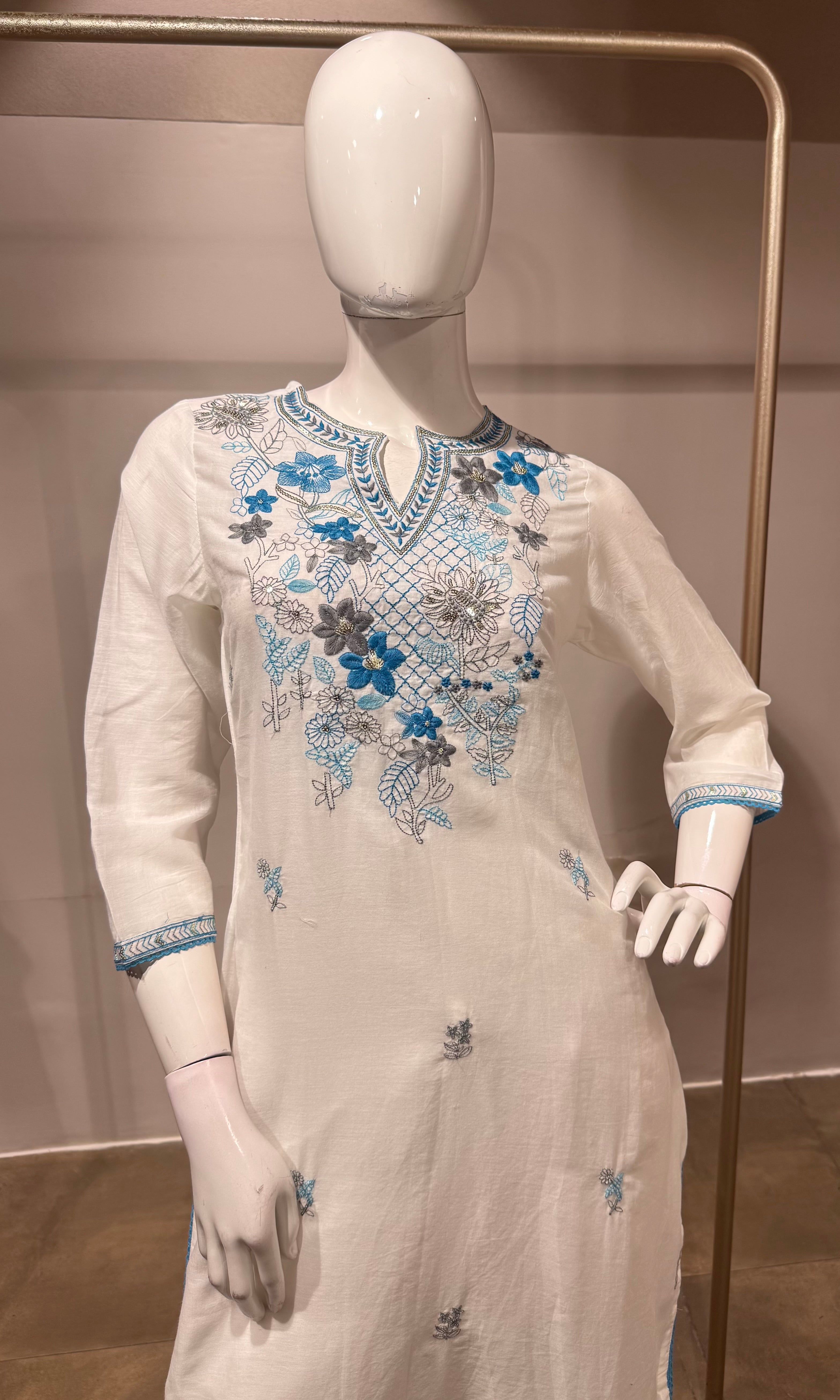 white kurta set features blue floral embroidery