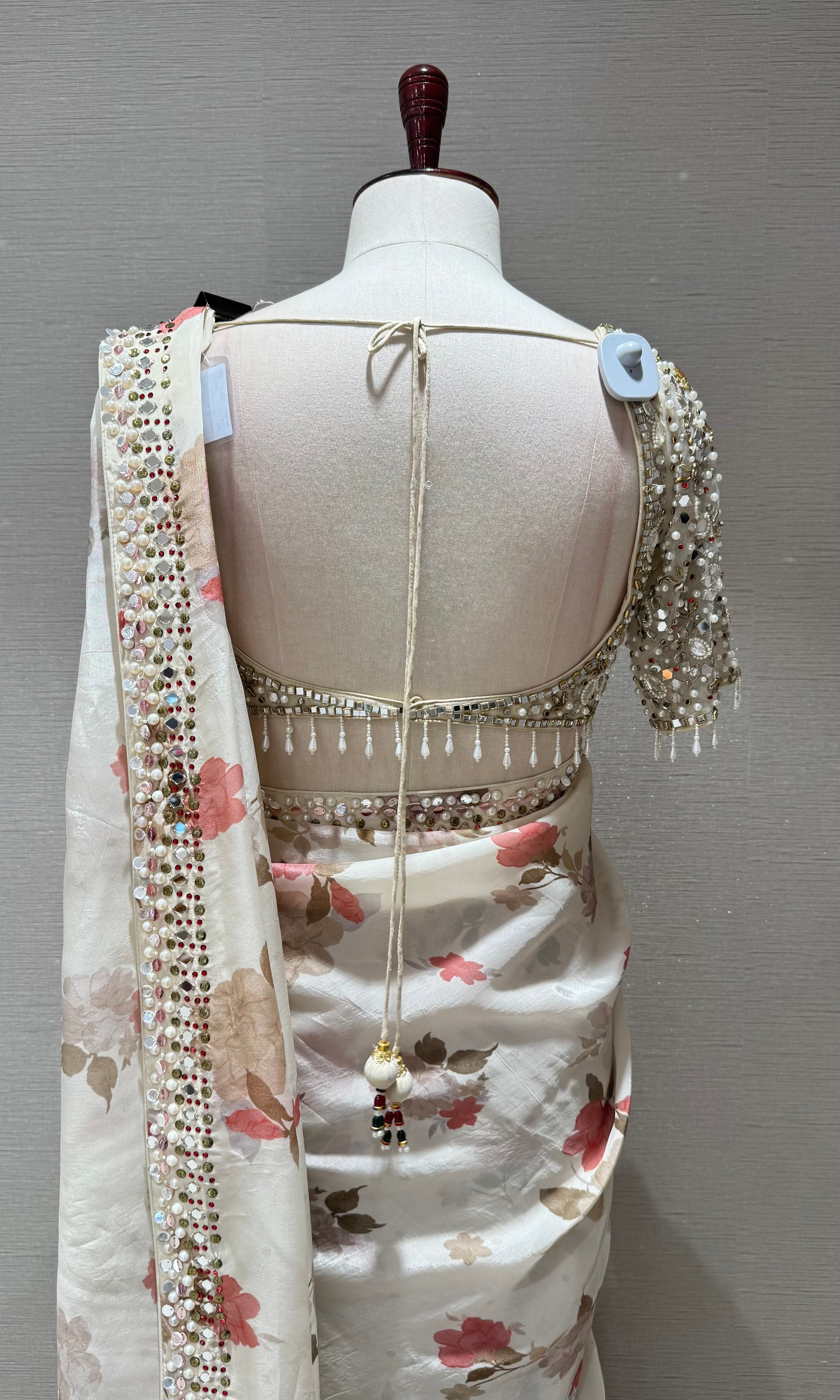 Cream elegant floral saree with embellished blouse