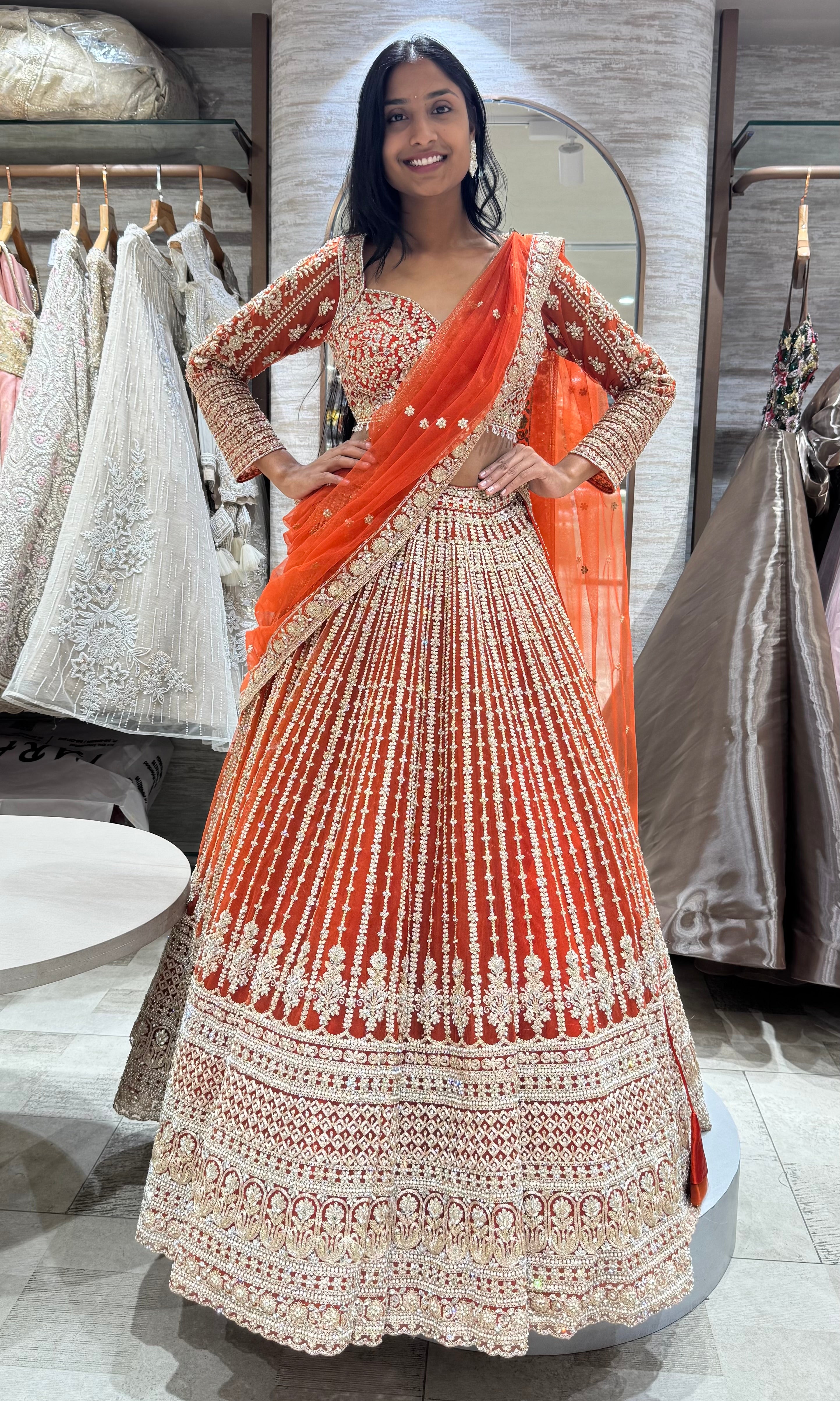 rust and white intricate embroidery lehenga