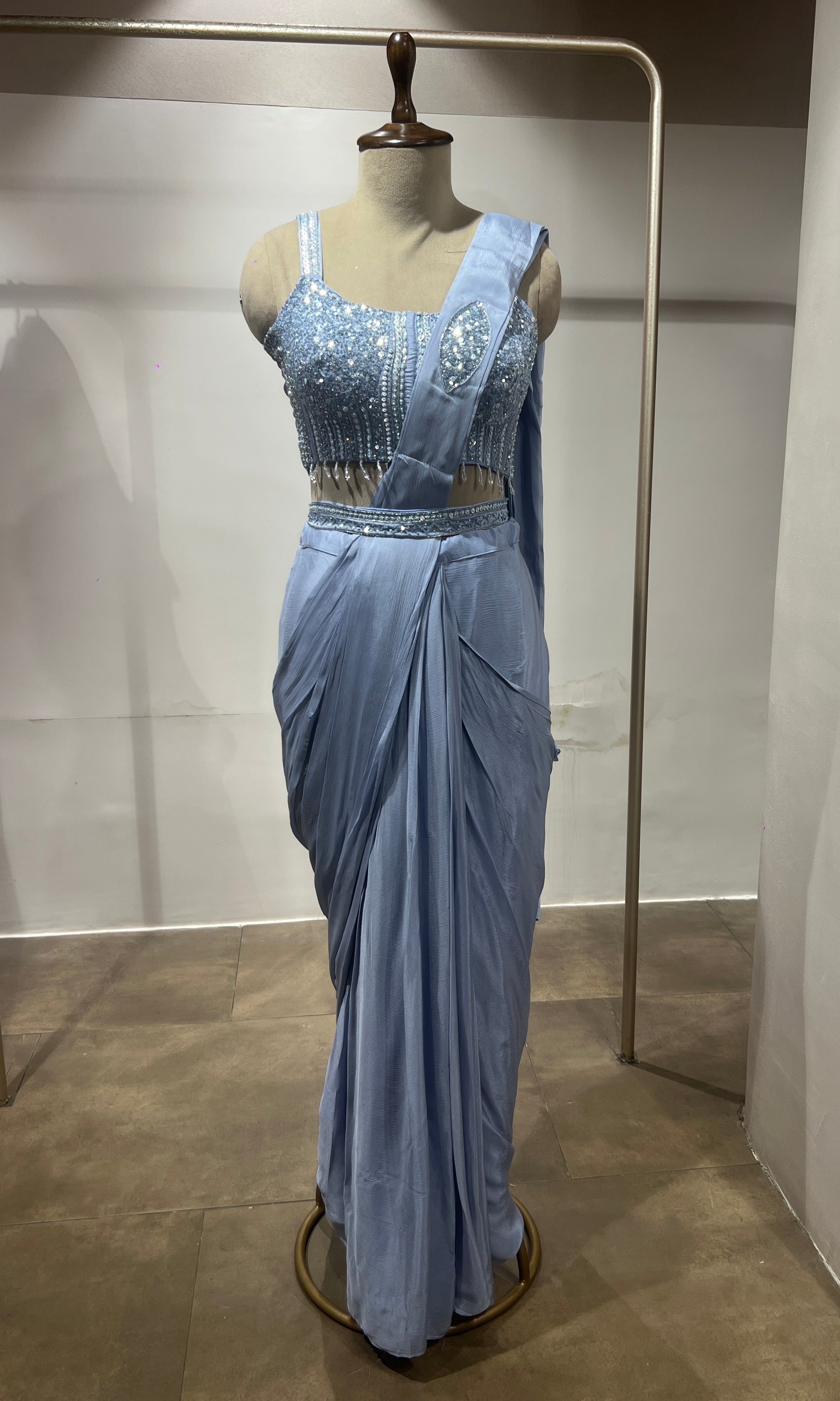 Blue satin drape saree with embellished blouse