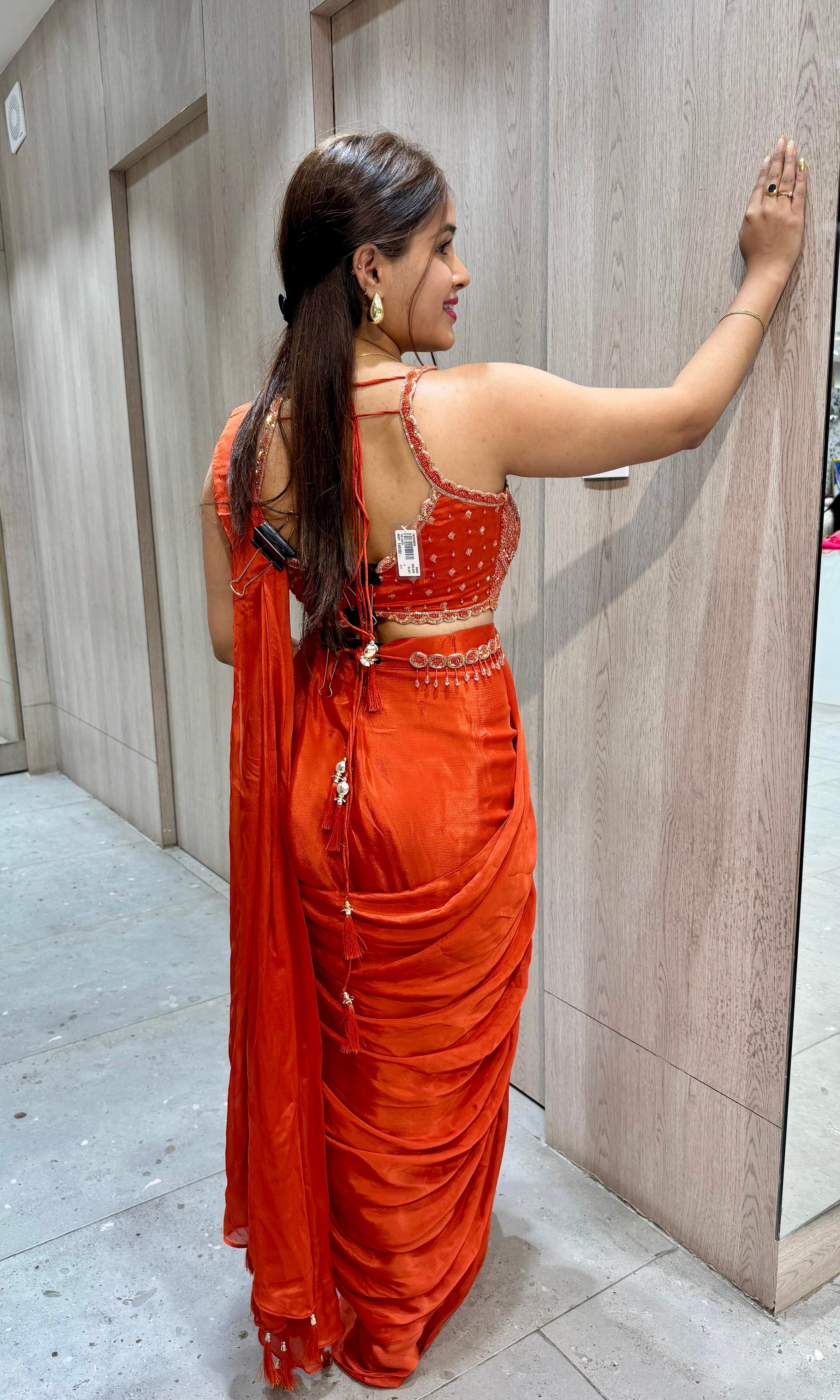 rust orange drape ruffled saree with blouse and belt