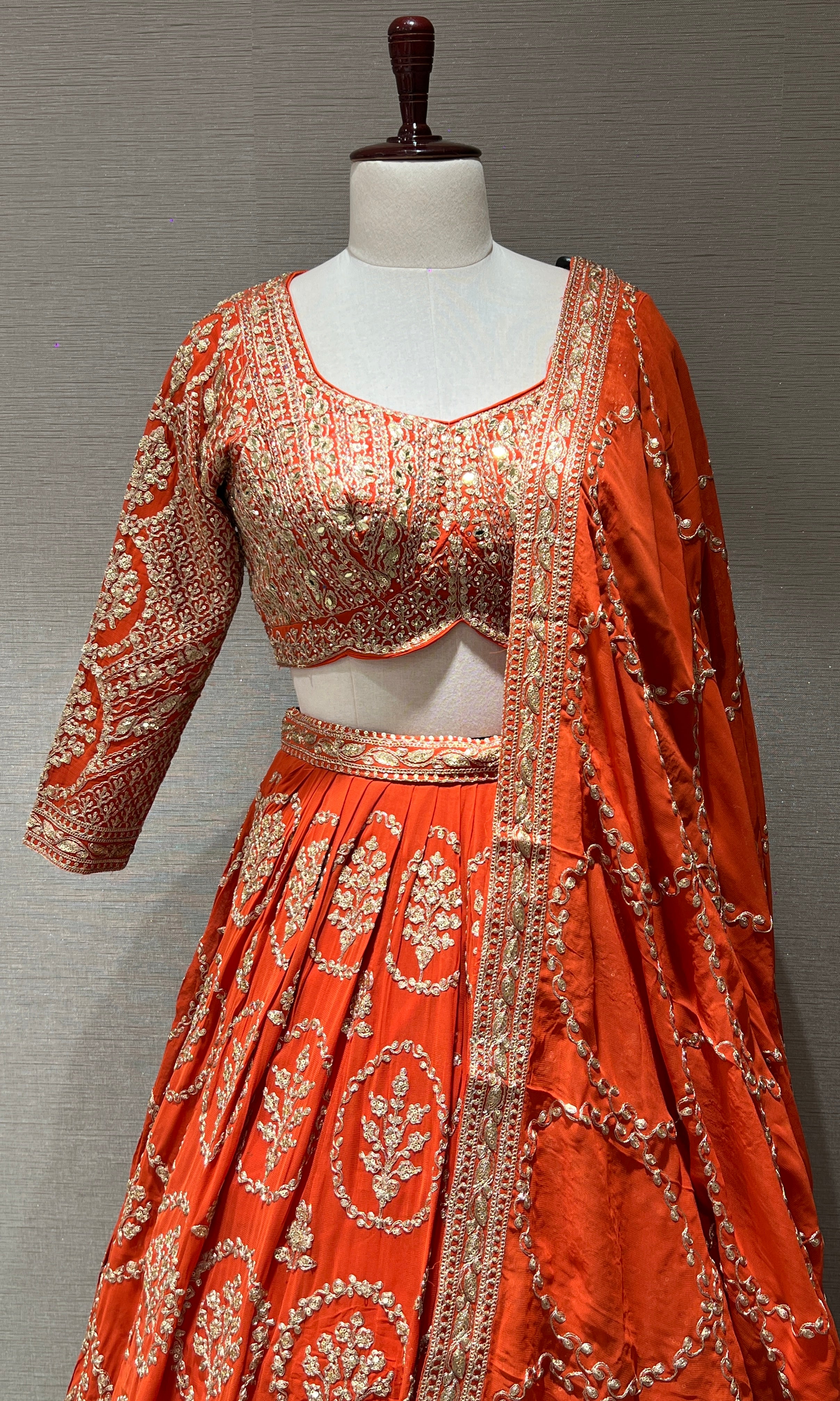 Orange Lehenga with zari and sequin gold embroidery