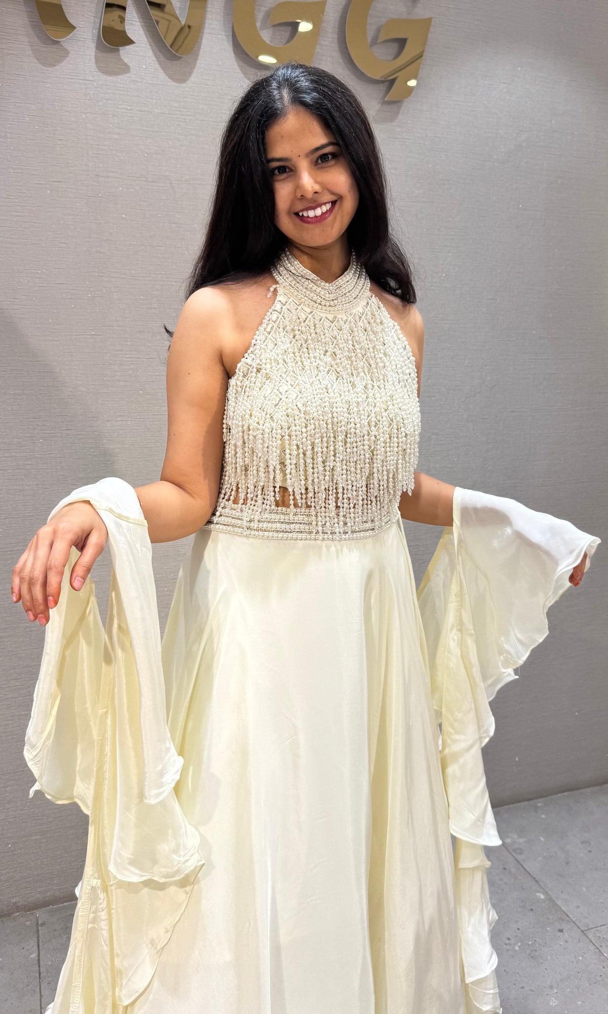 Cream Halter Lehenga with Beaded Fringe Ruffled Sleeves