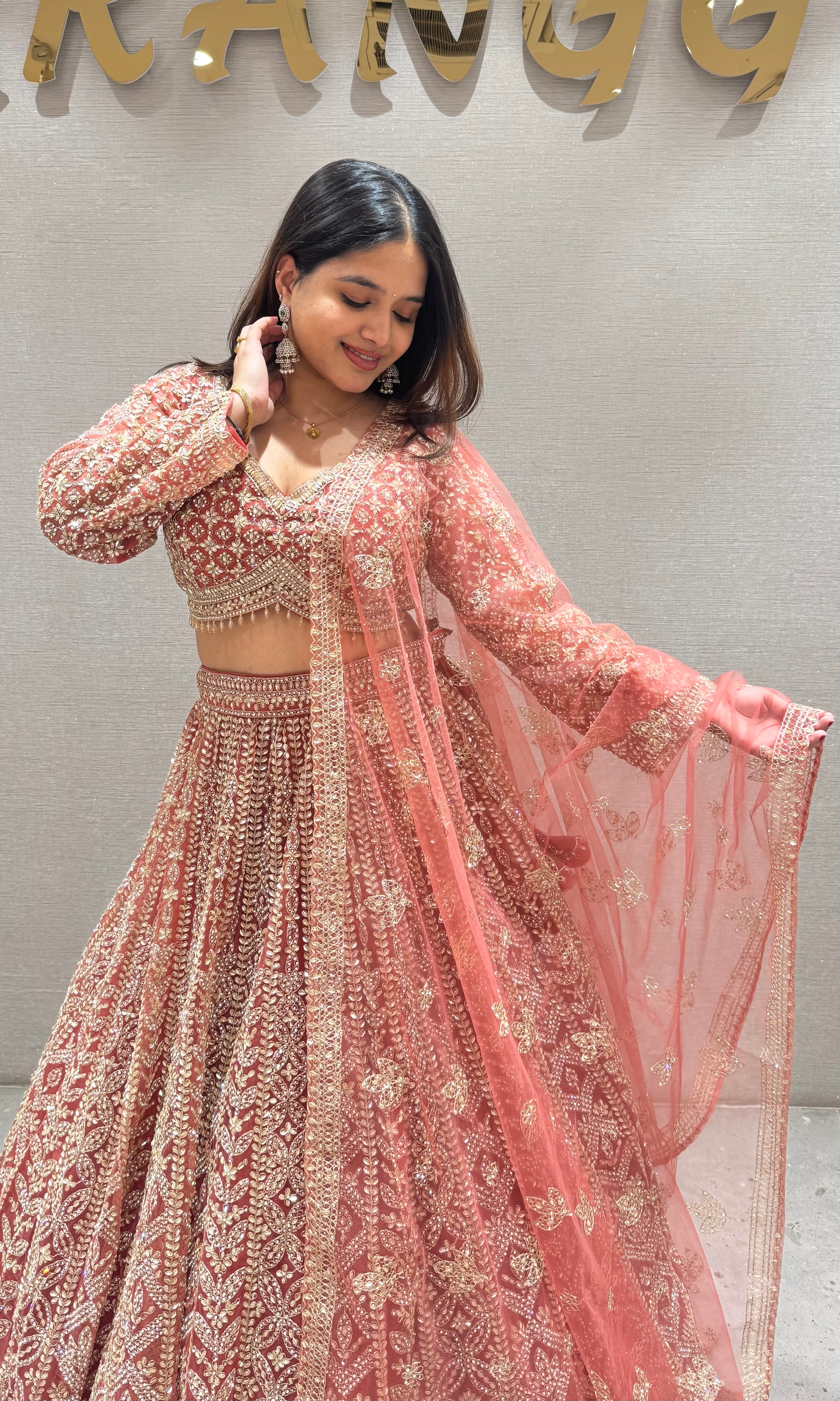 Peachy Orange lehenga with stone work