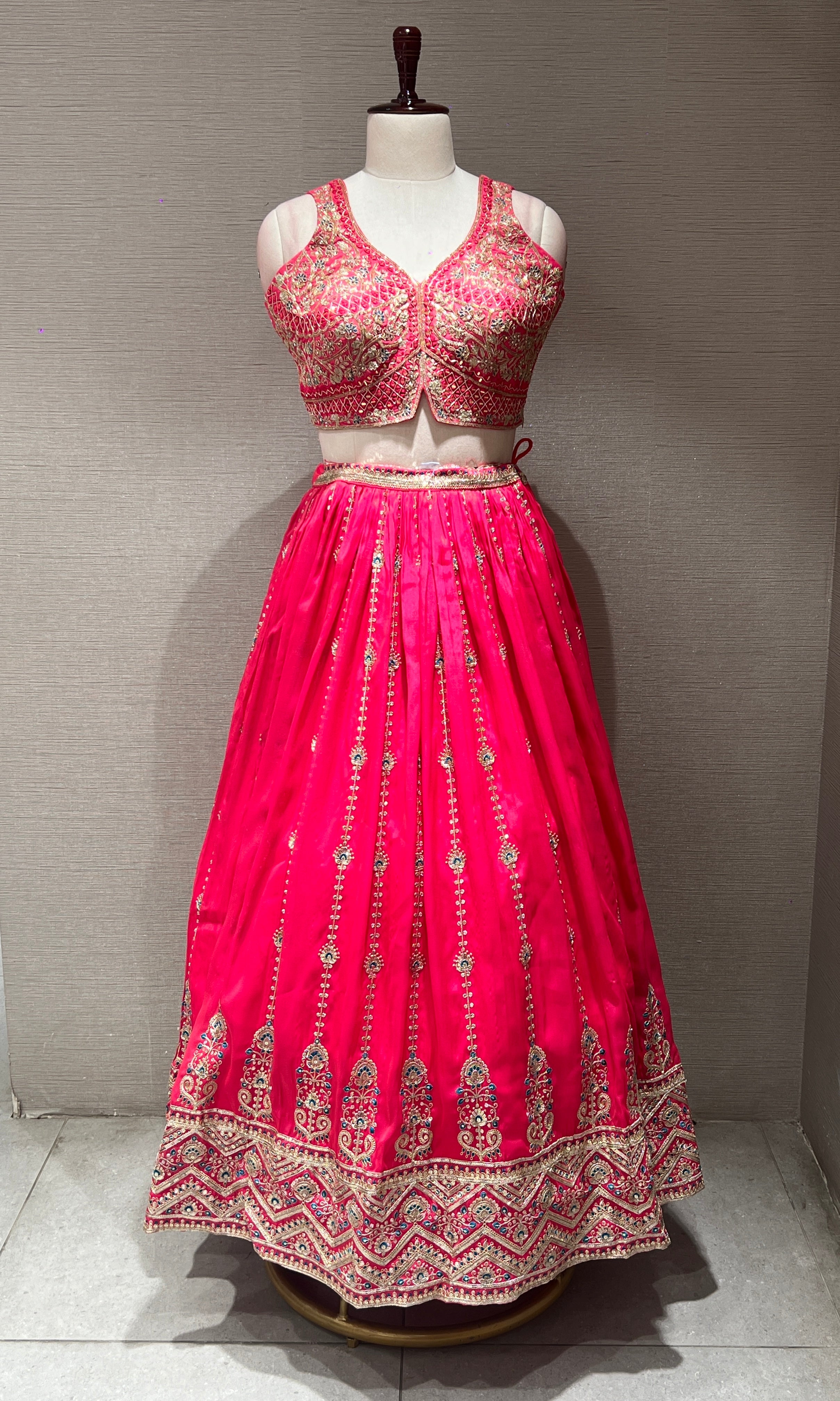 rani pink lehenga with intricate embroidery