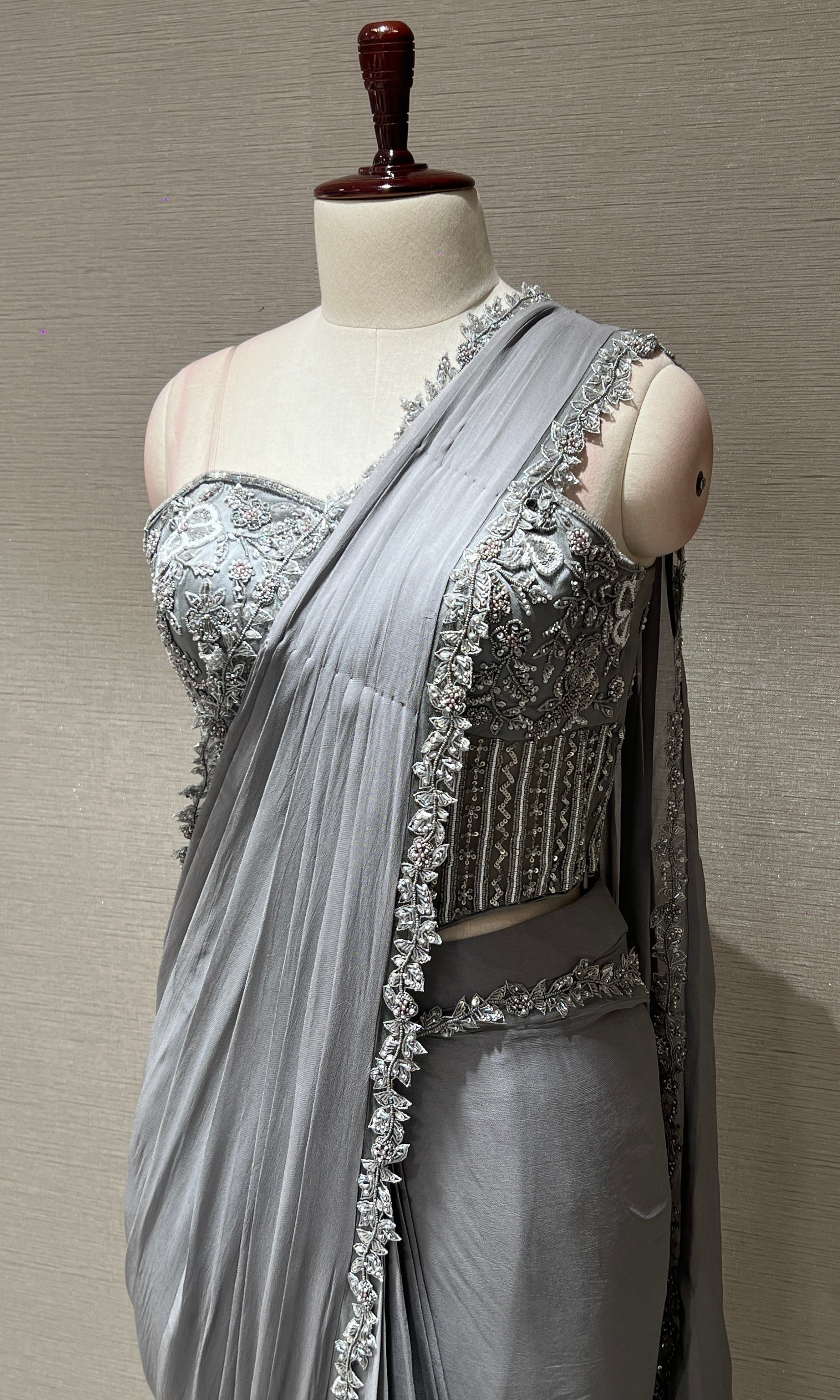 grey drape saree with embroidered corset blouse