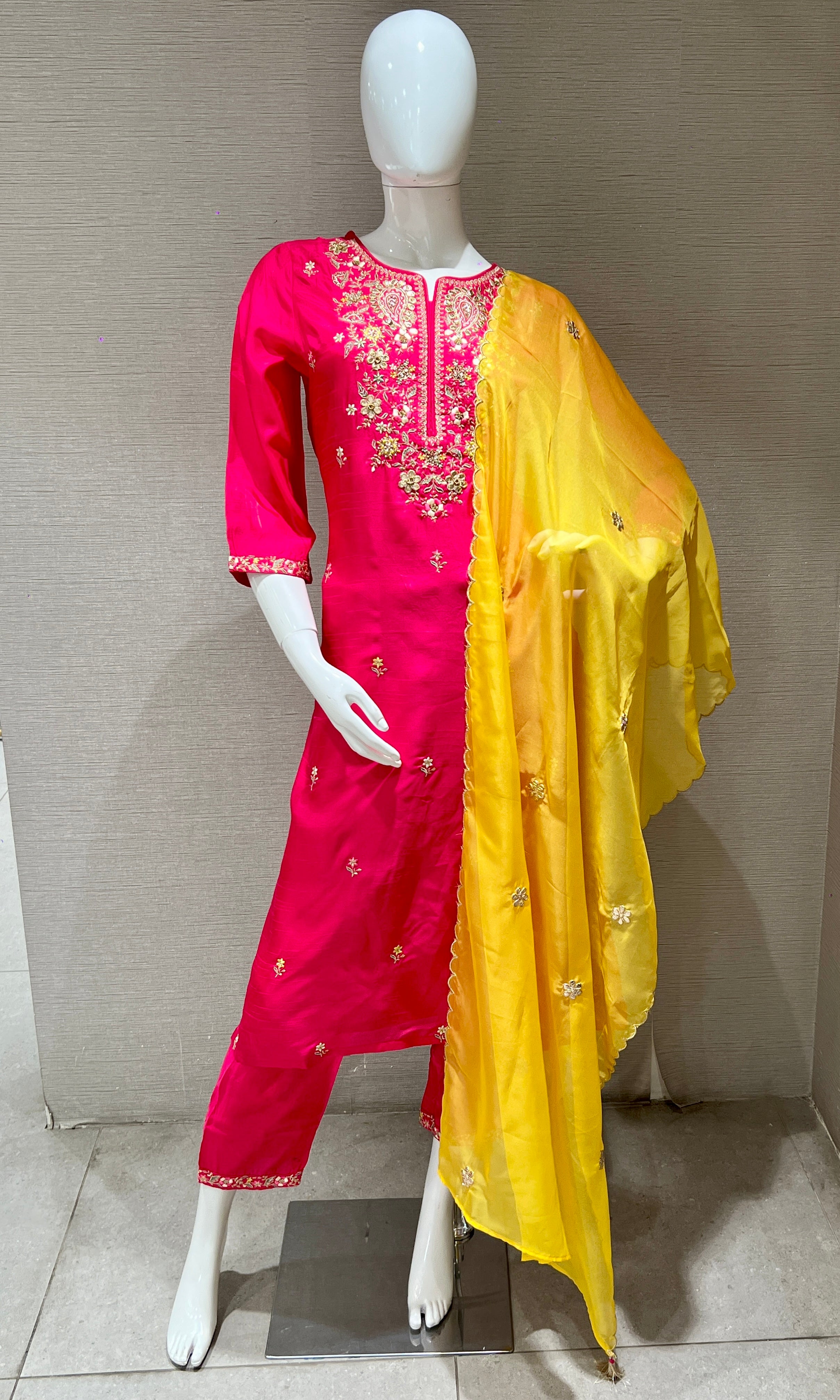 Pink kurta set with a yellow dupatta