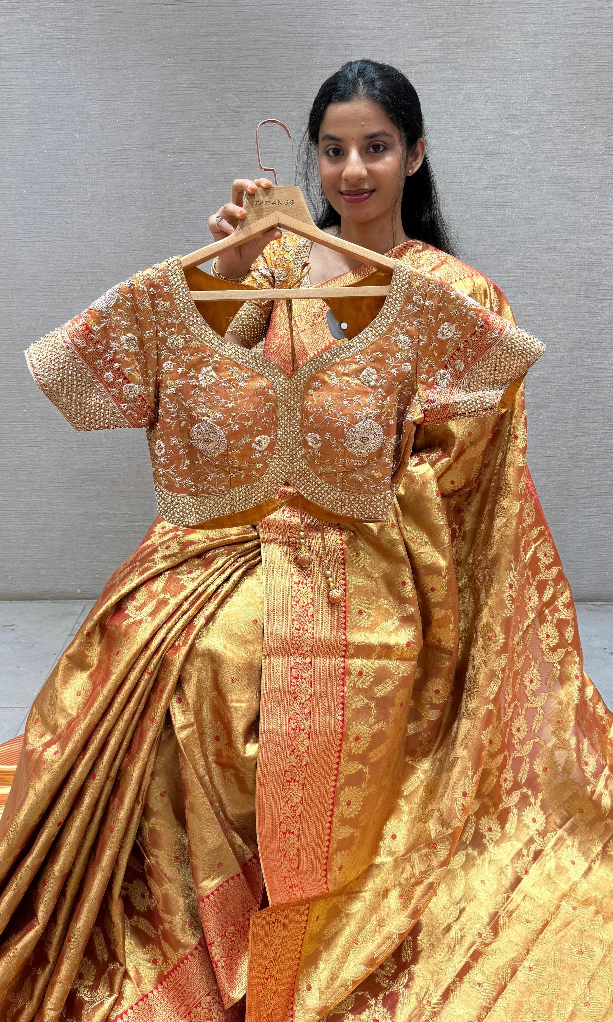 Red and gold saree with embroidered ready blouse