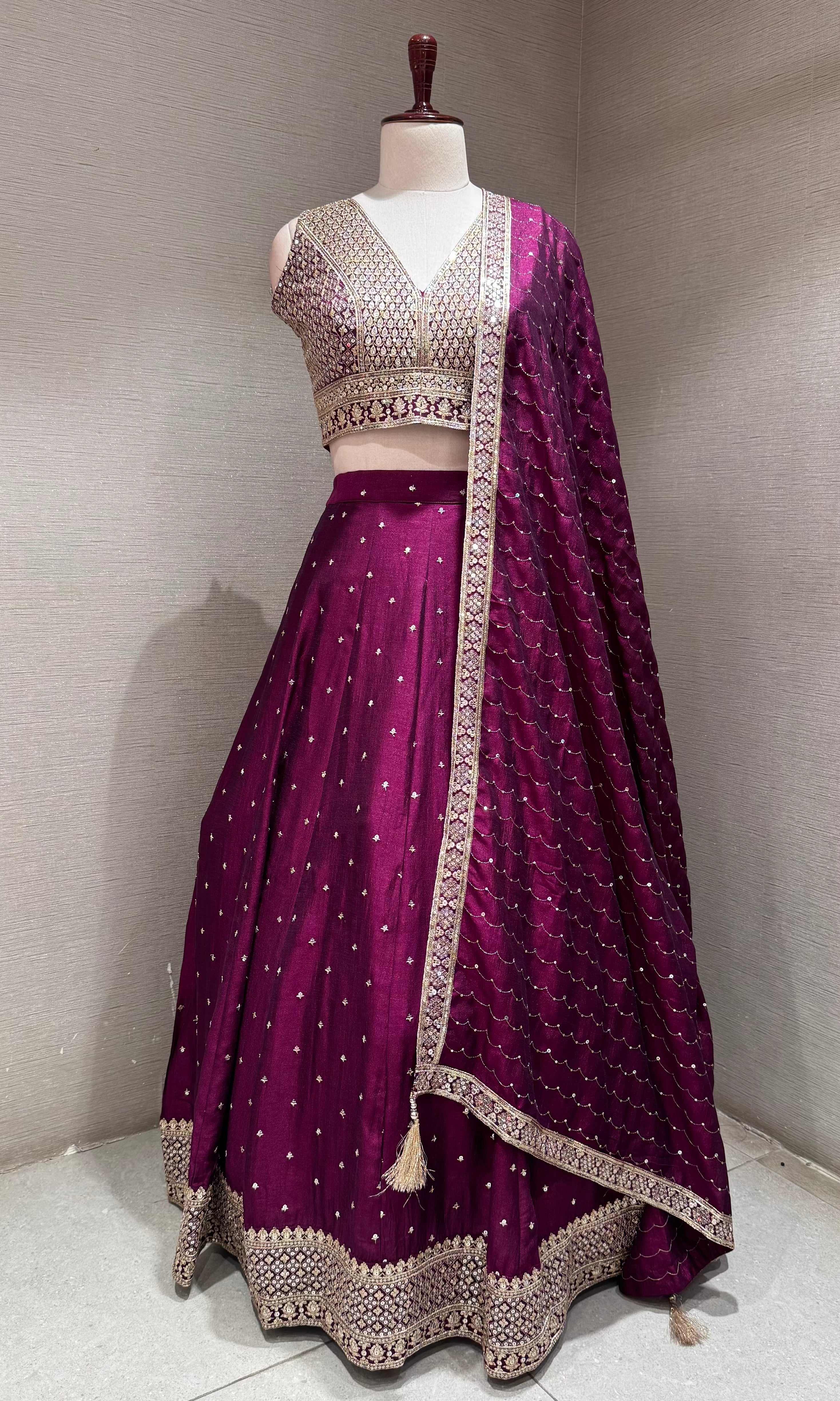 Wine and gold embroidered Lehenga Choli