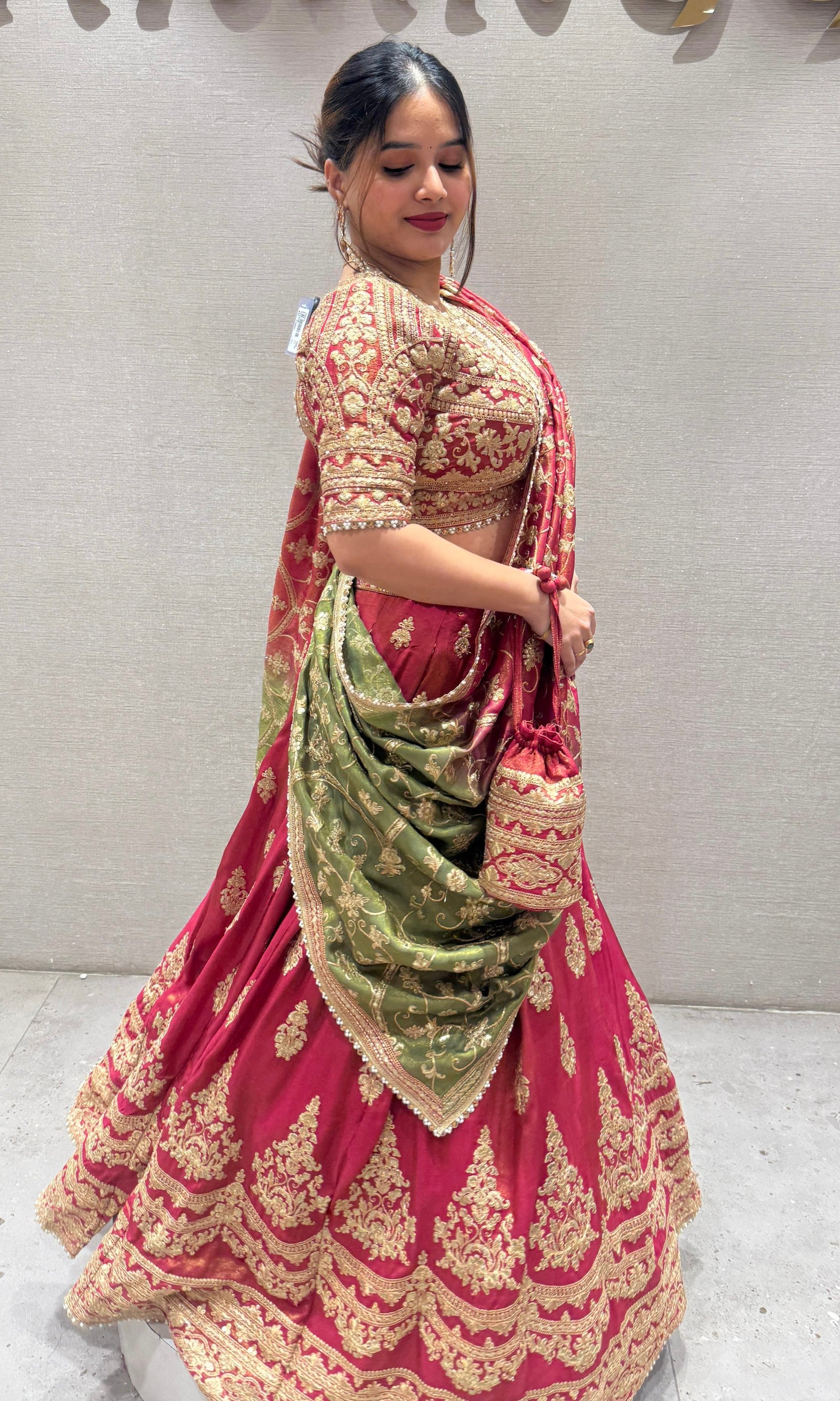 Brick red and green Lehenga with potli