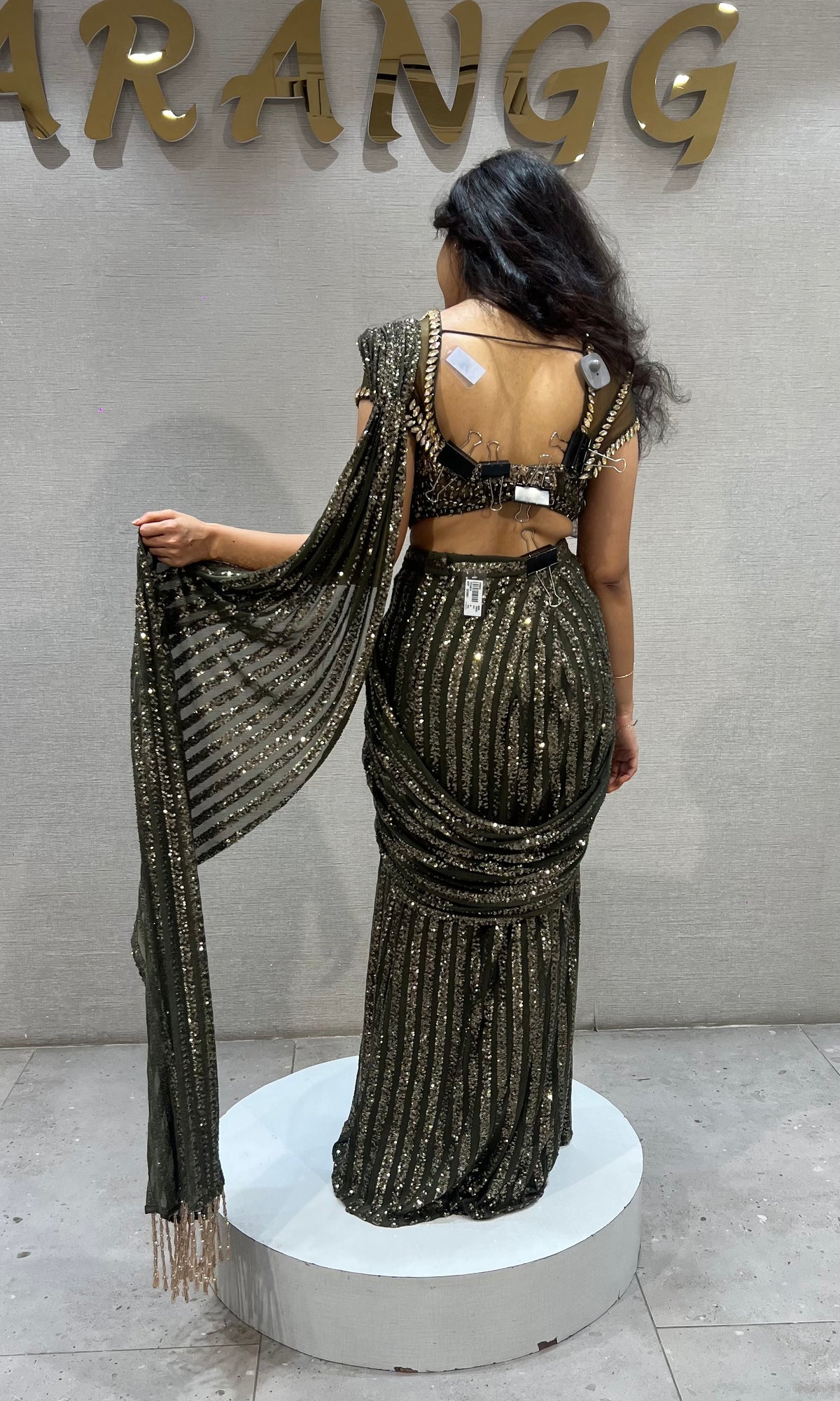 green shimmer metallic drape saree with embellished blouse