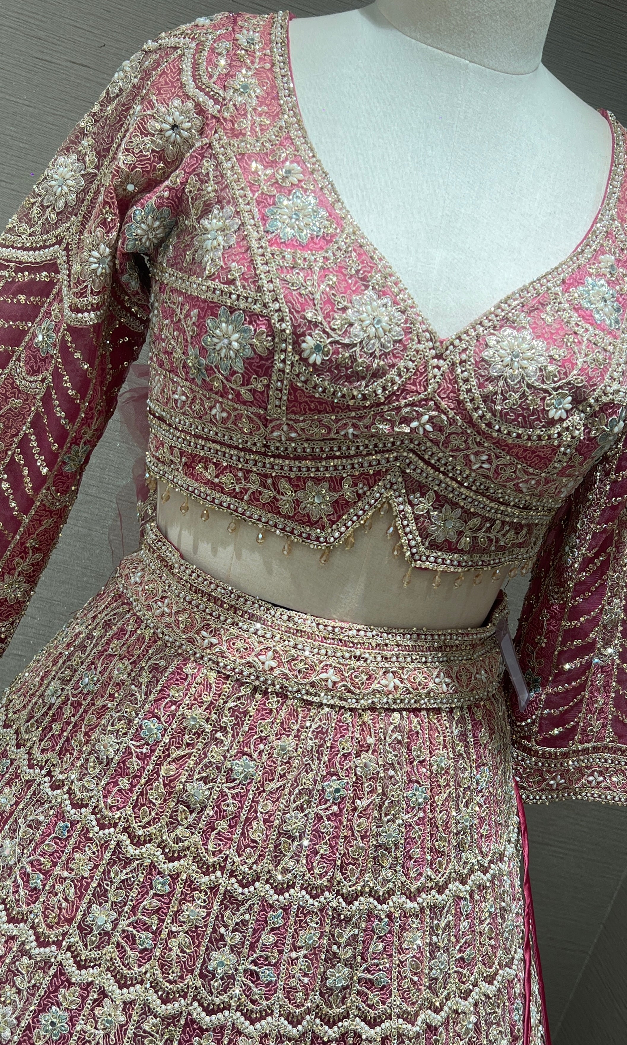 Pink lehenga with intricate embroidery and zari work