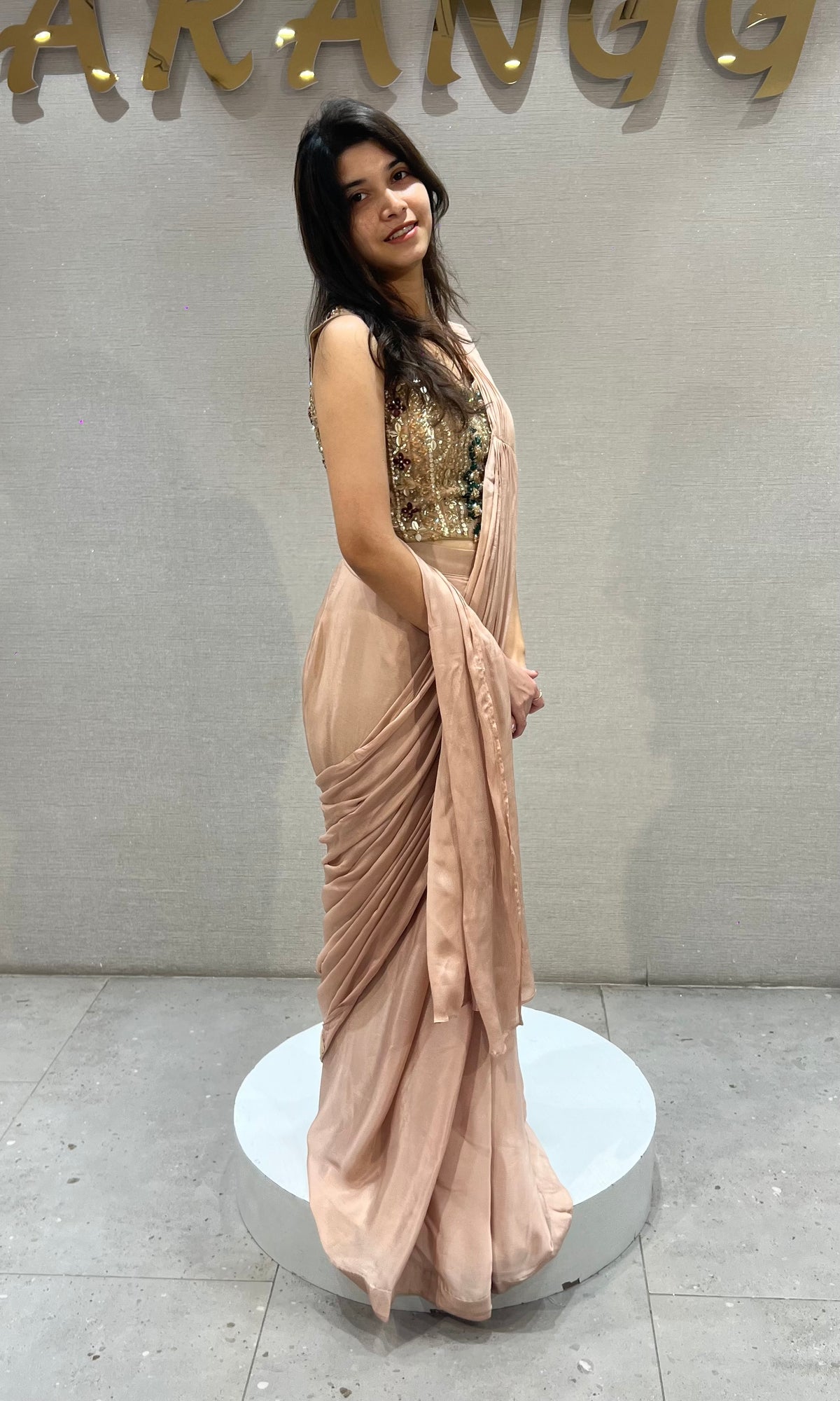 Dusty Georgette drape saree with gold & emerald green detailing blouse