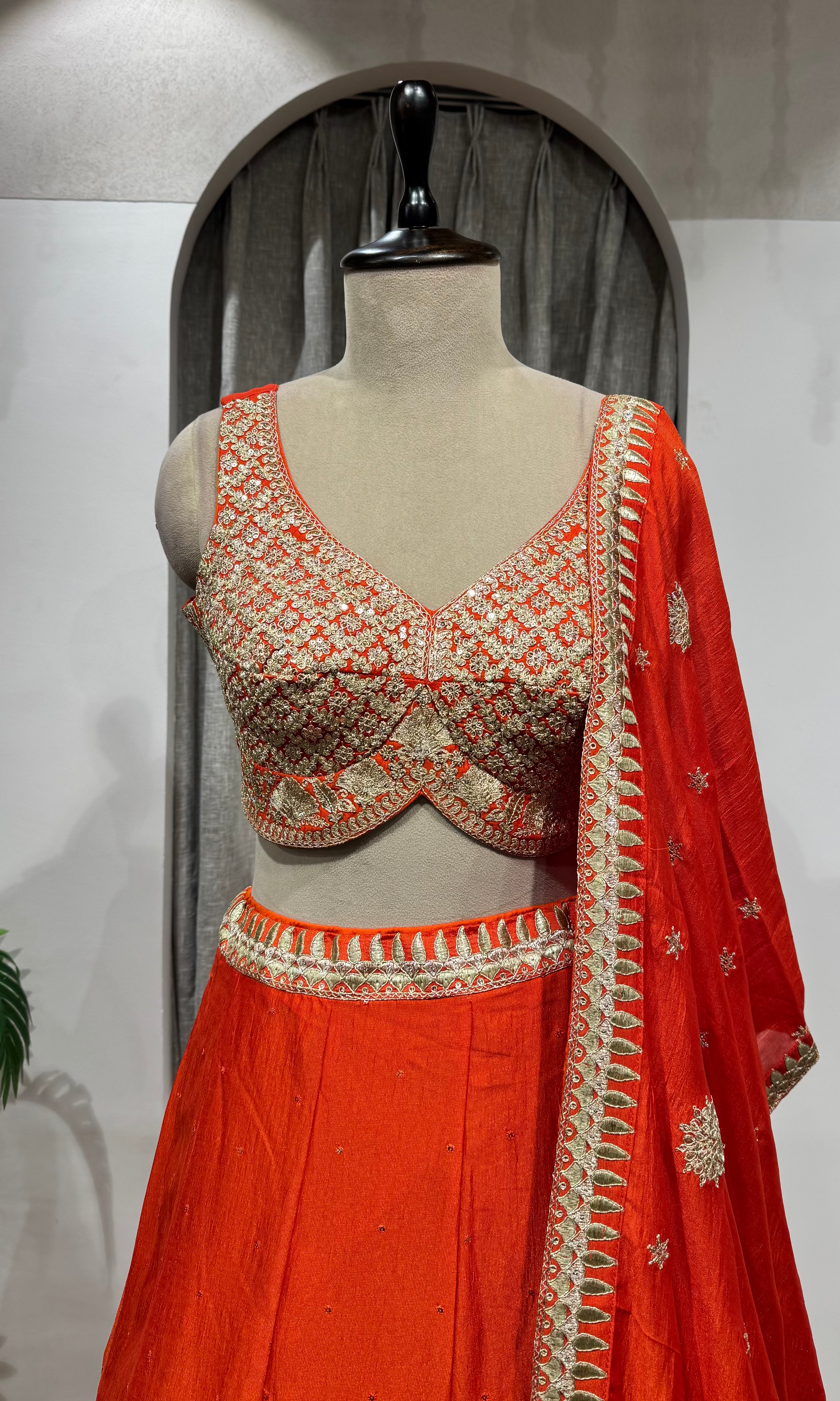 ORANGE LEHENGA WITH GOLDEN EMBROIDERY