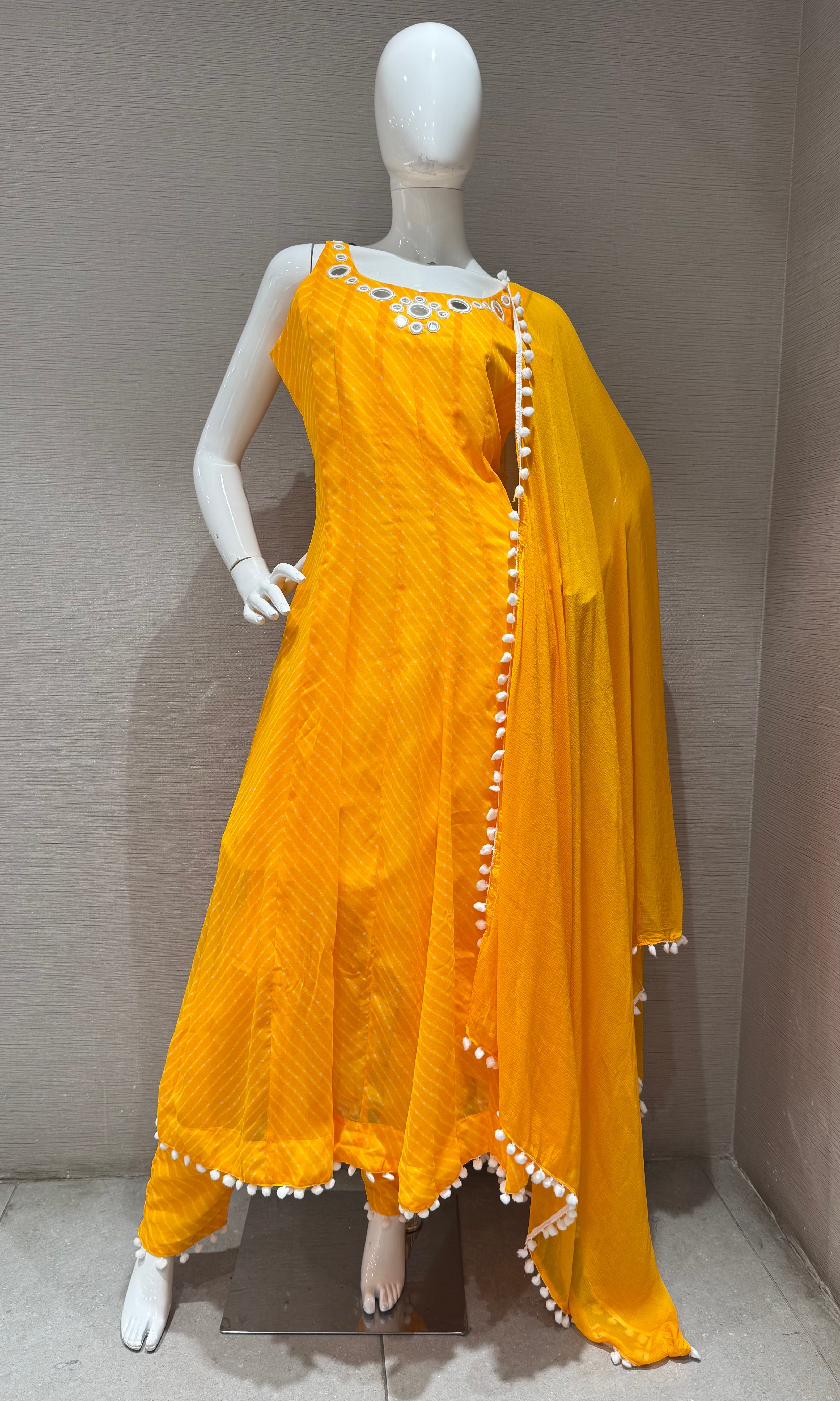 yellow bandhani print and intricate mirror anarkali set