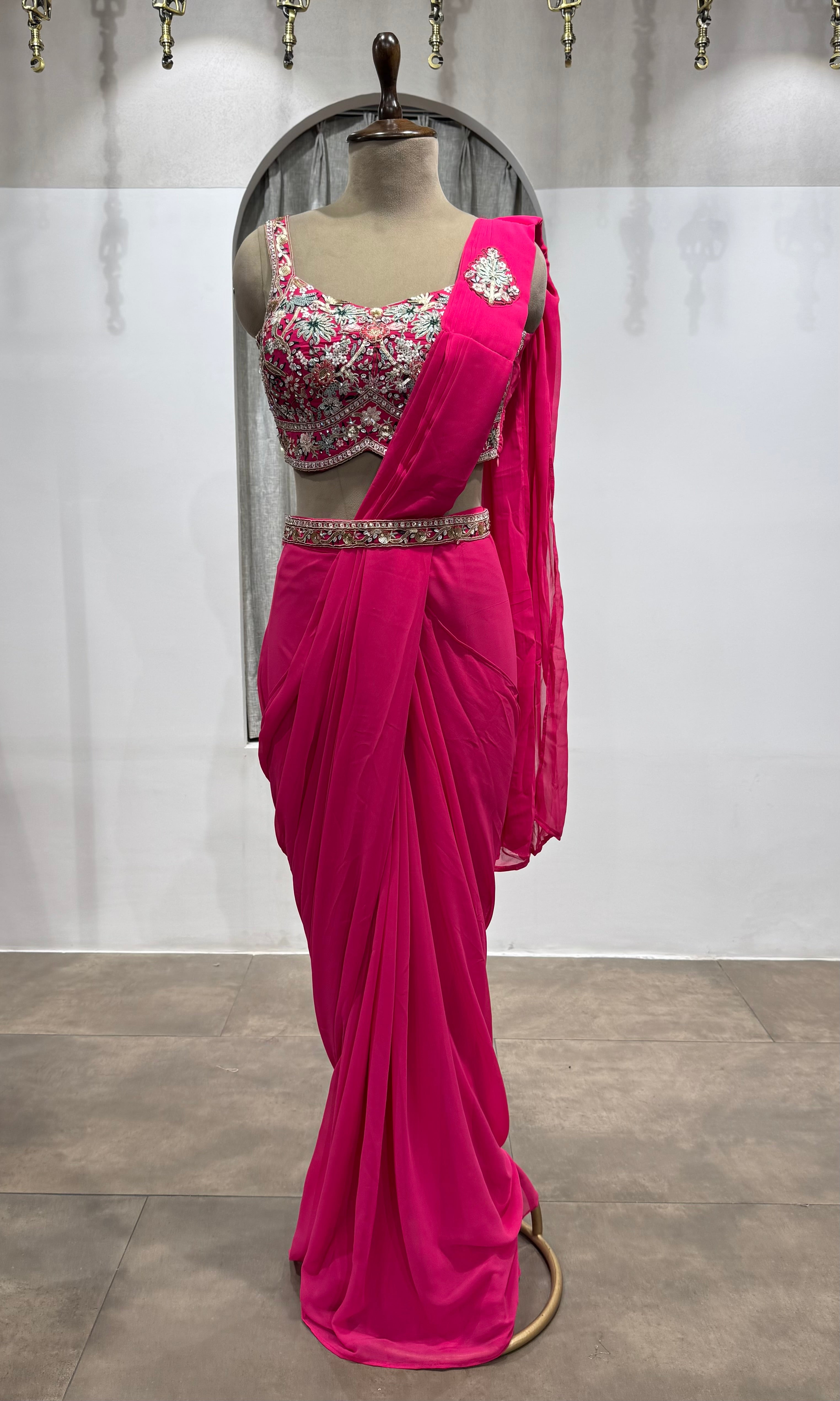 Pink drape saree with floral blouse & belt