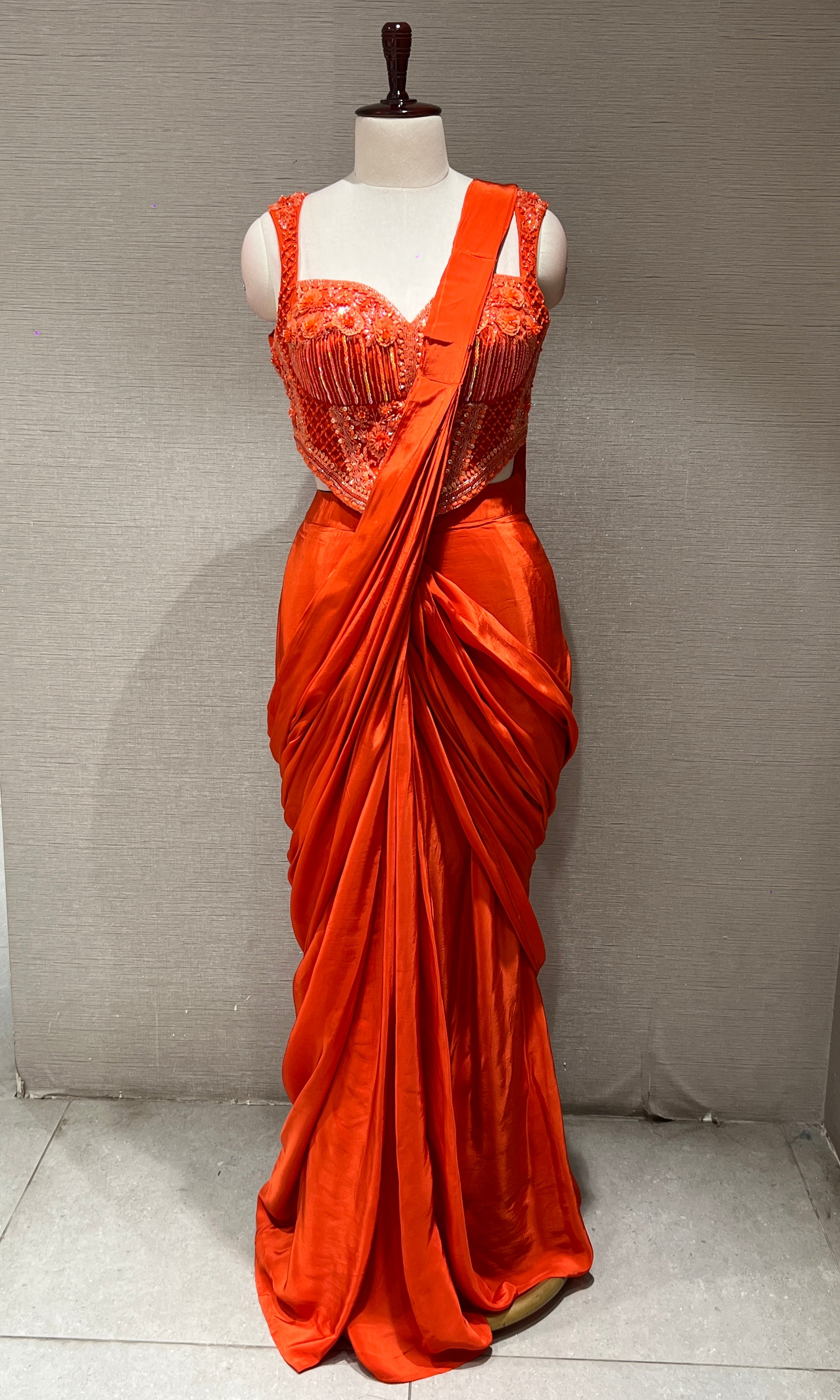 Orange drape saree with corset blouse