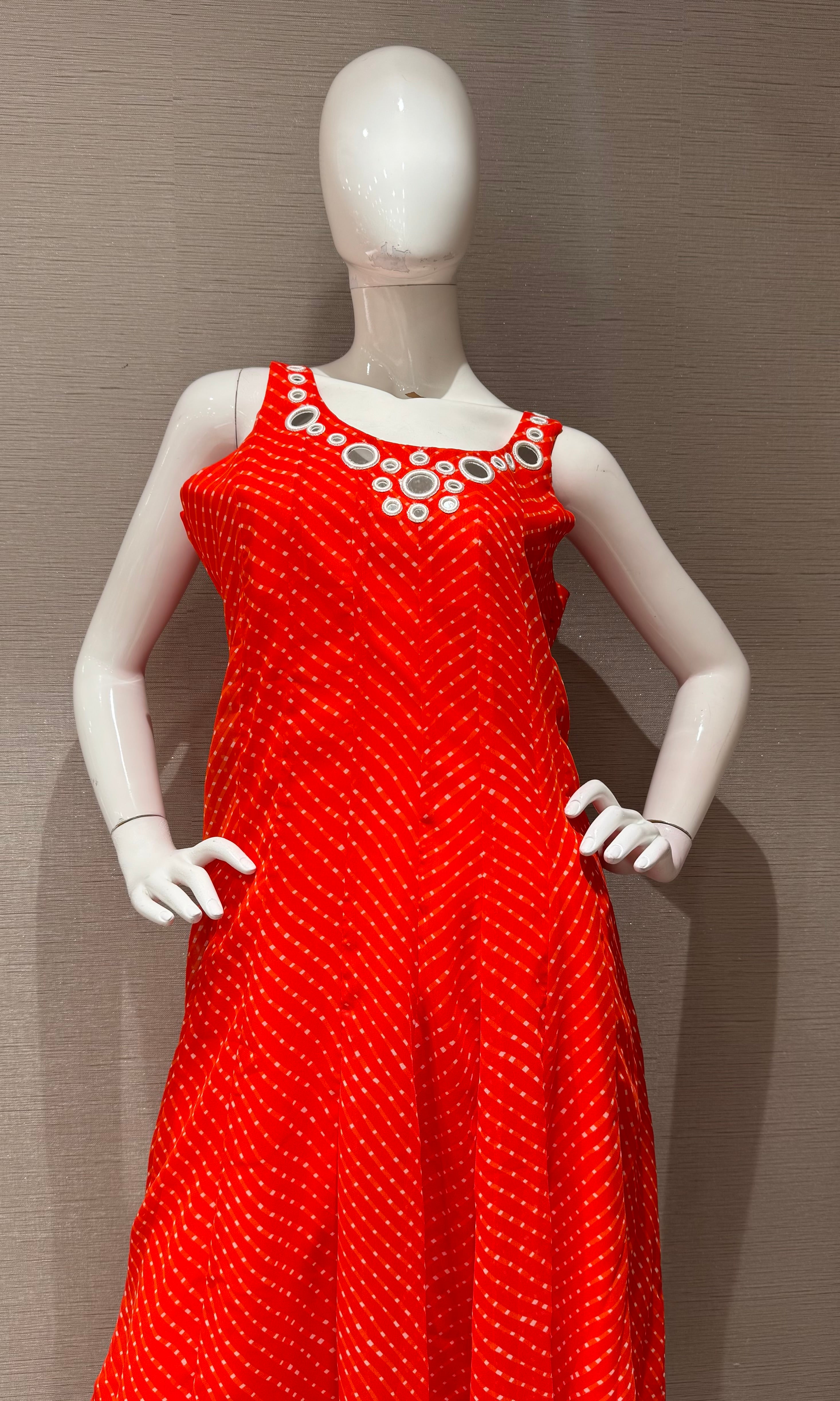 Orange bandhani print and intricate mirror anarkali set